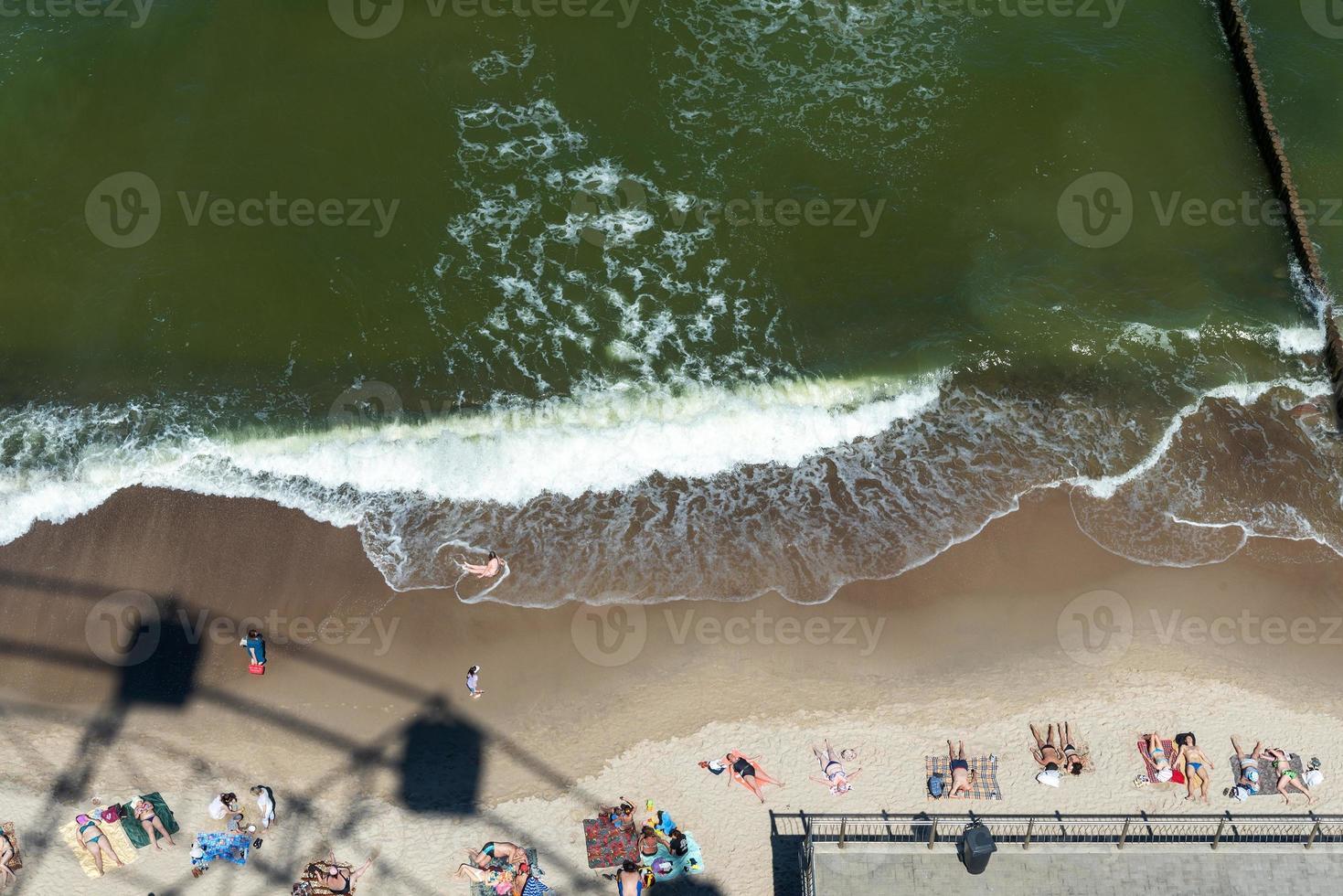 Zelenogradsk June 2021, The shadow of the Ferris wheel on the sand near the Baltic Sea coast photo
