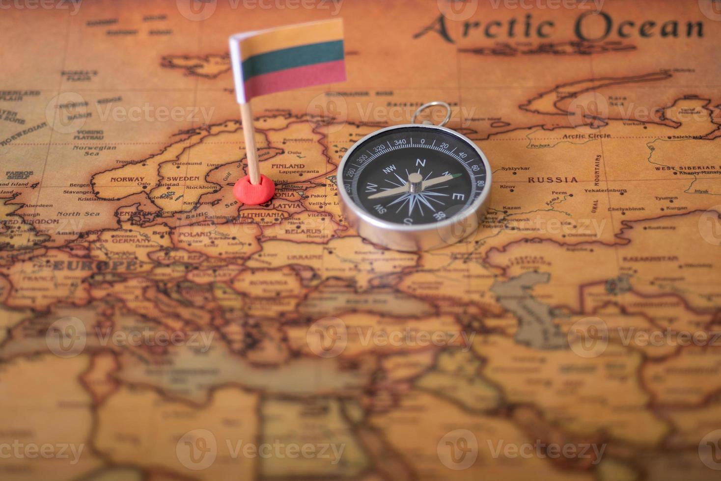 Flag of Lithuania and compass of the world map. photo