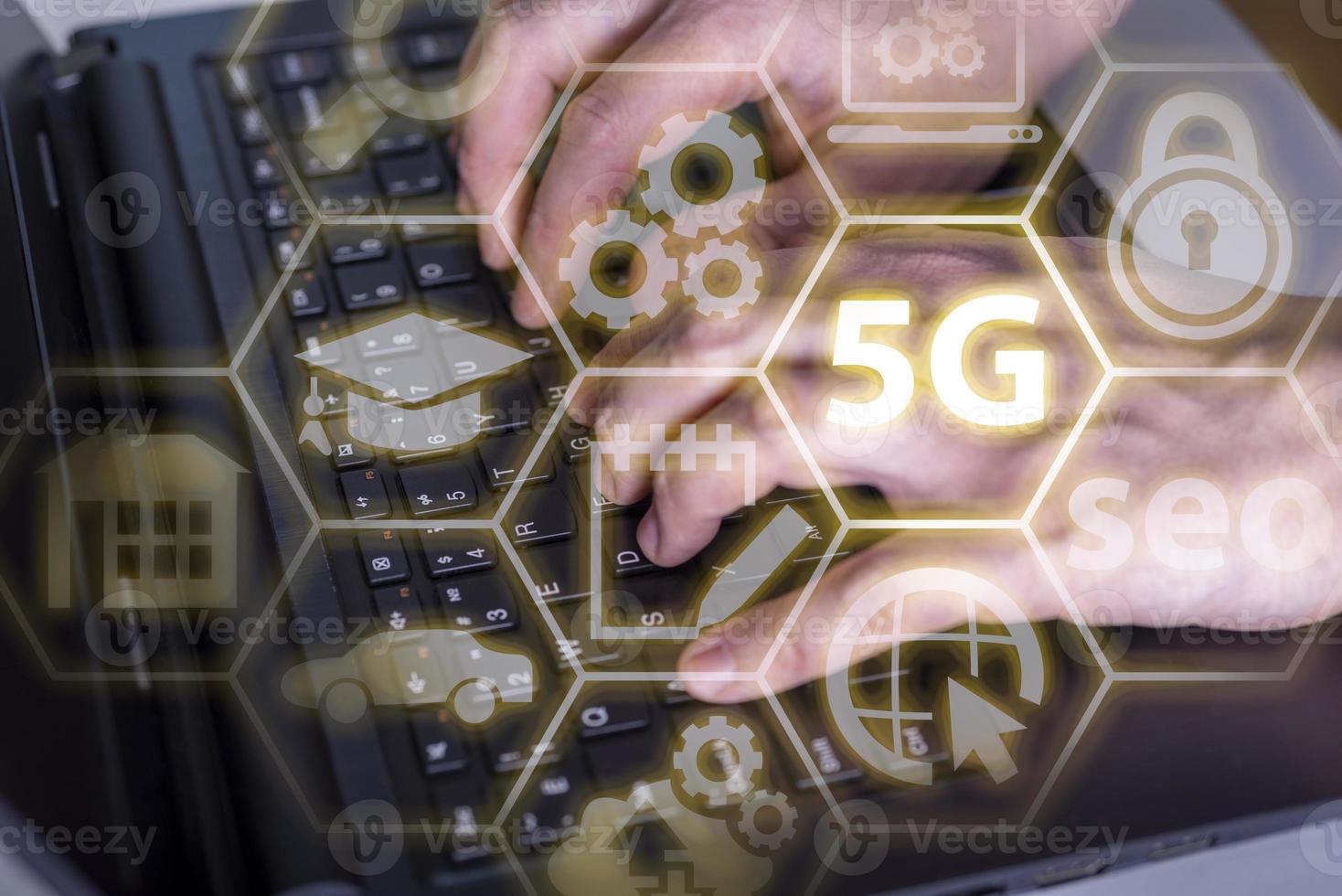 Close up of hand using laptop with glowing 5G internet hologram. Connection and network concept. Double exposure photo