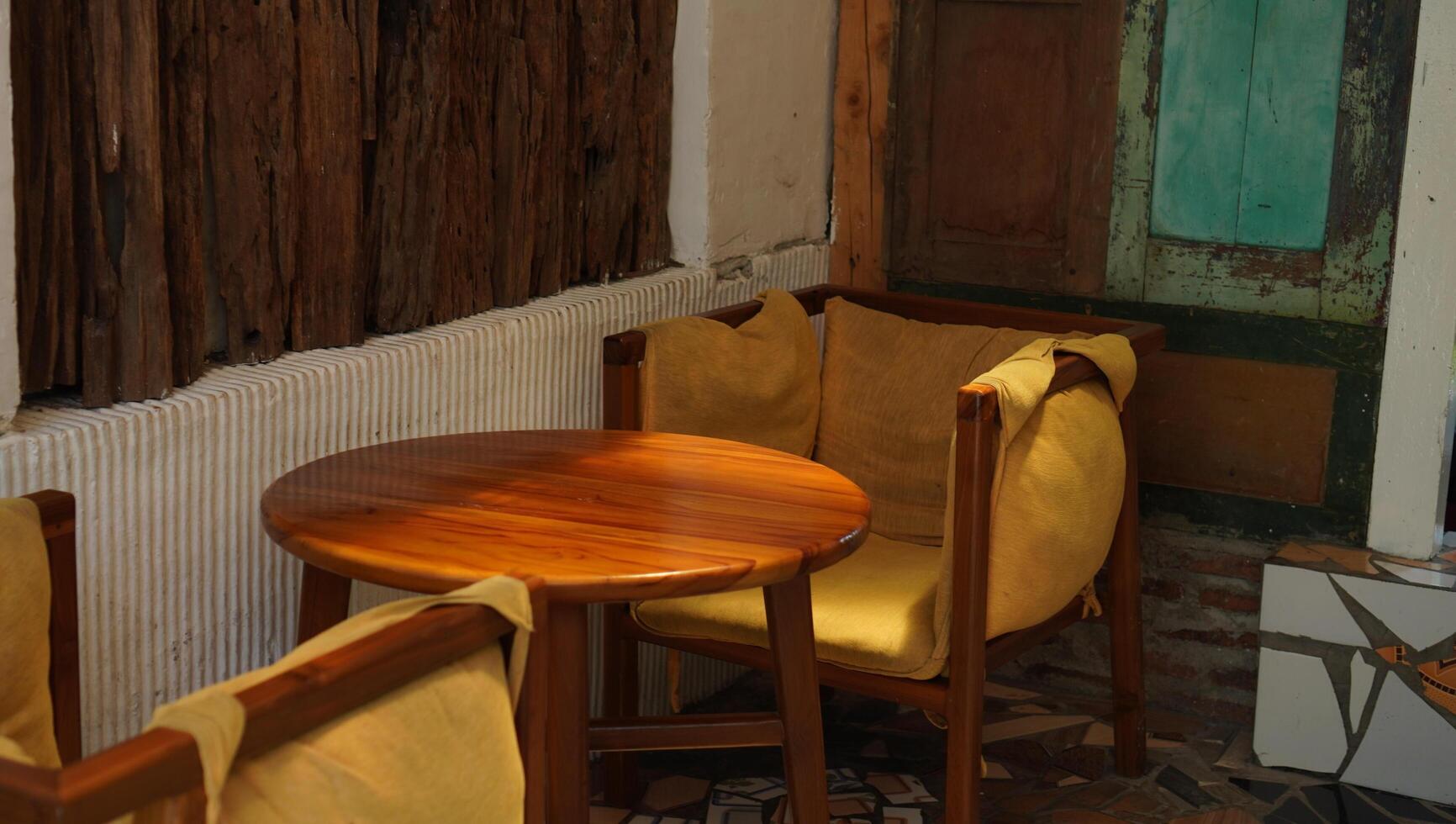 Classic armchairs and tables for a vintage interior of a coffee shop. photo