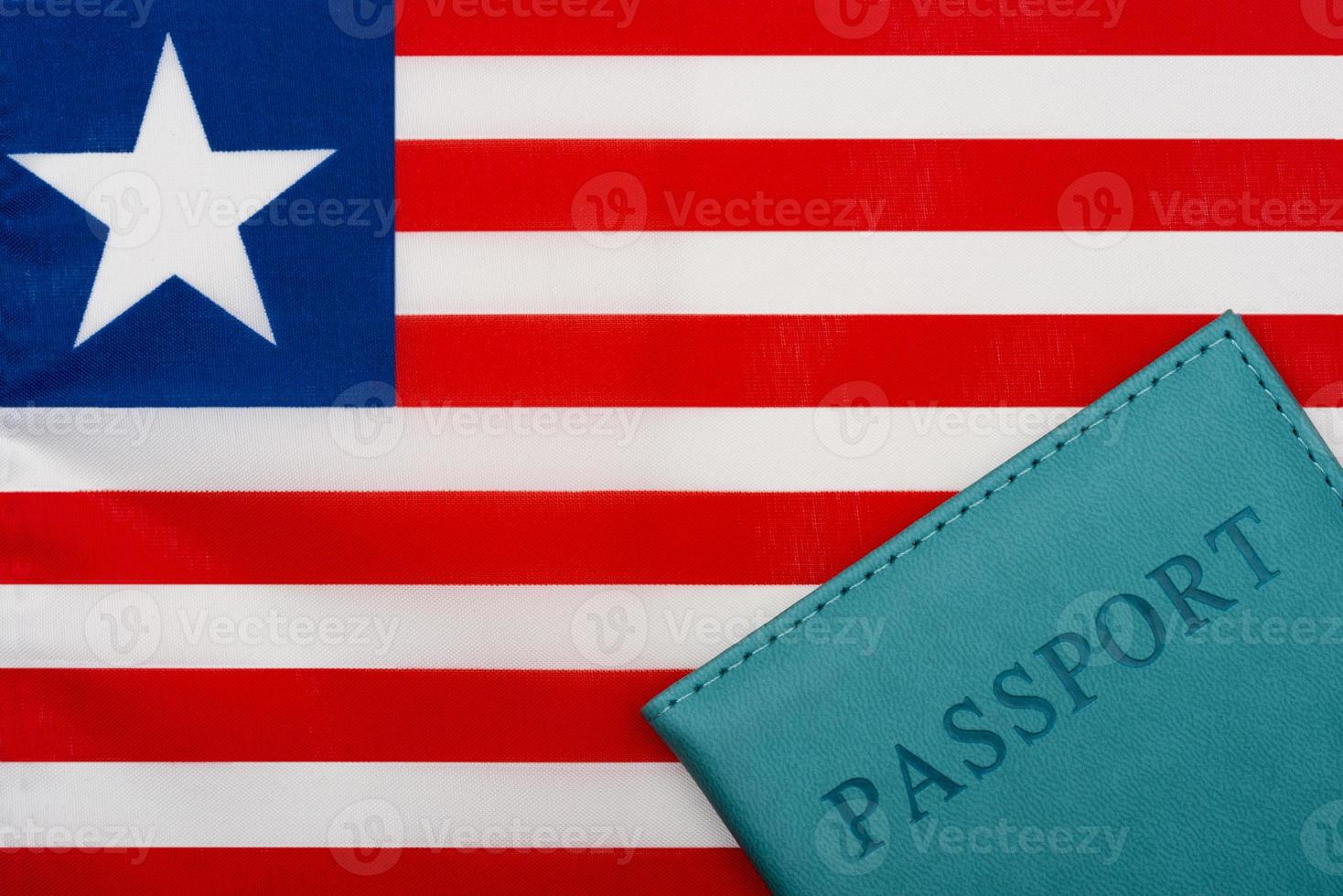 On the background of the flag of Liberia is a passport. photo