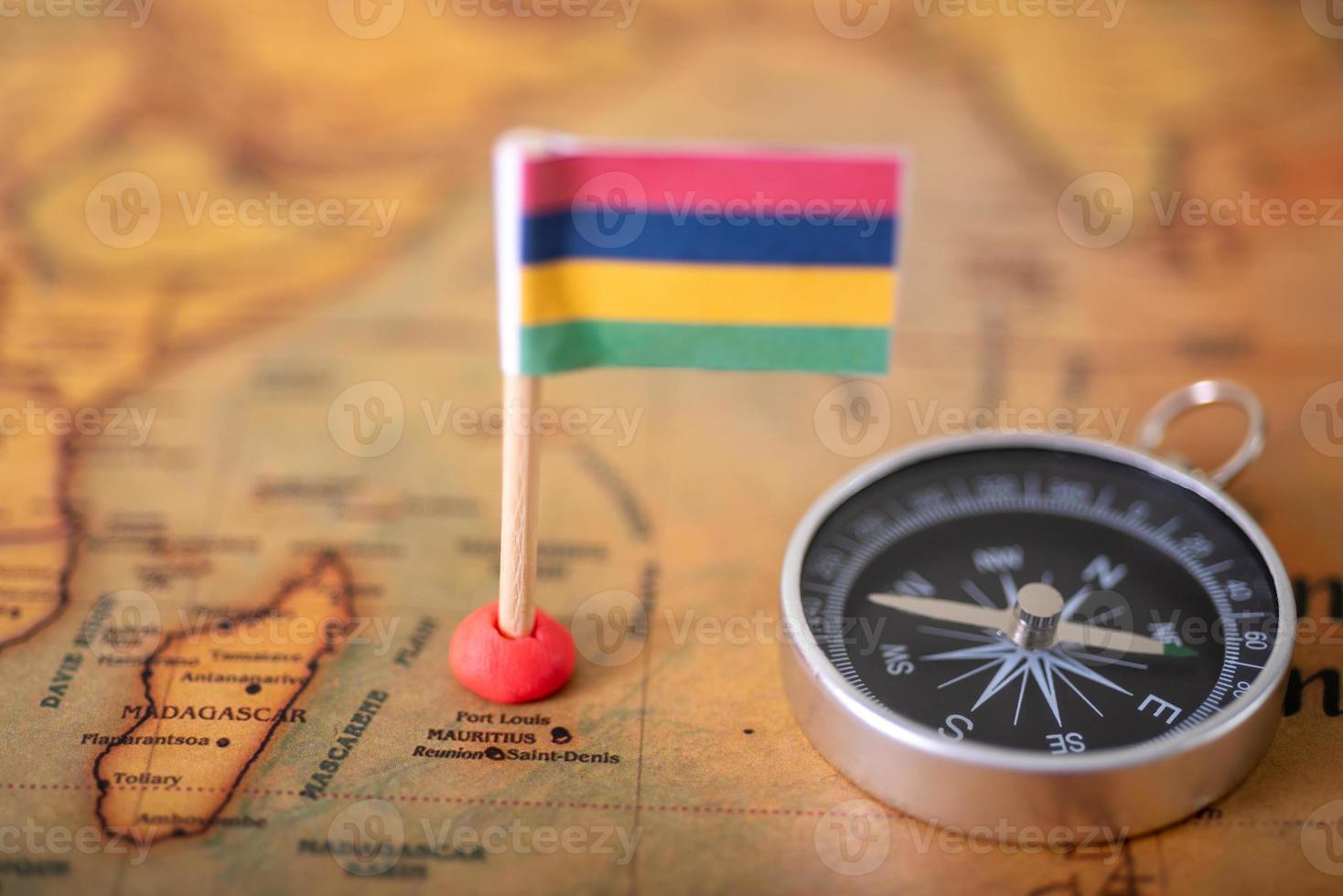 Flag of Mauritius and compass on the world map. photo