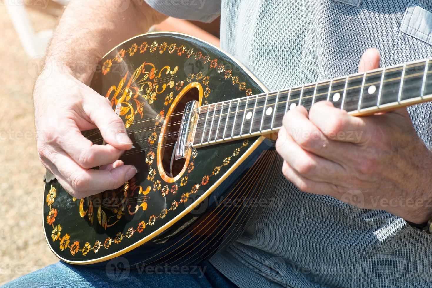 Bouzouki outdoor performance player photo