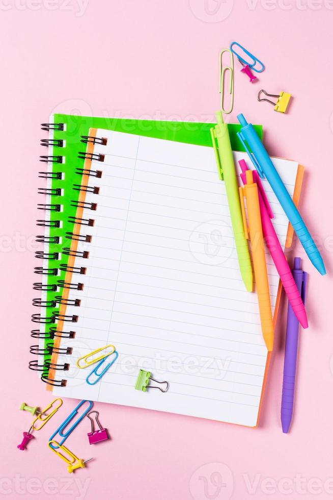 School background with notebooks and colorful supplies photo