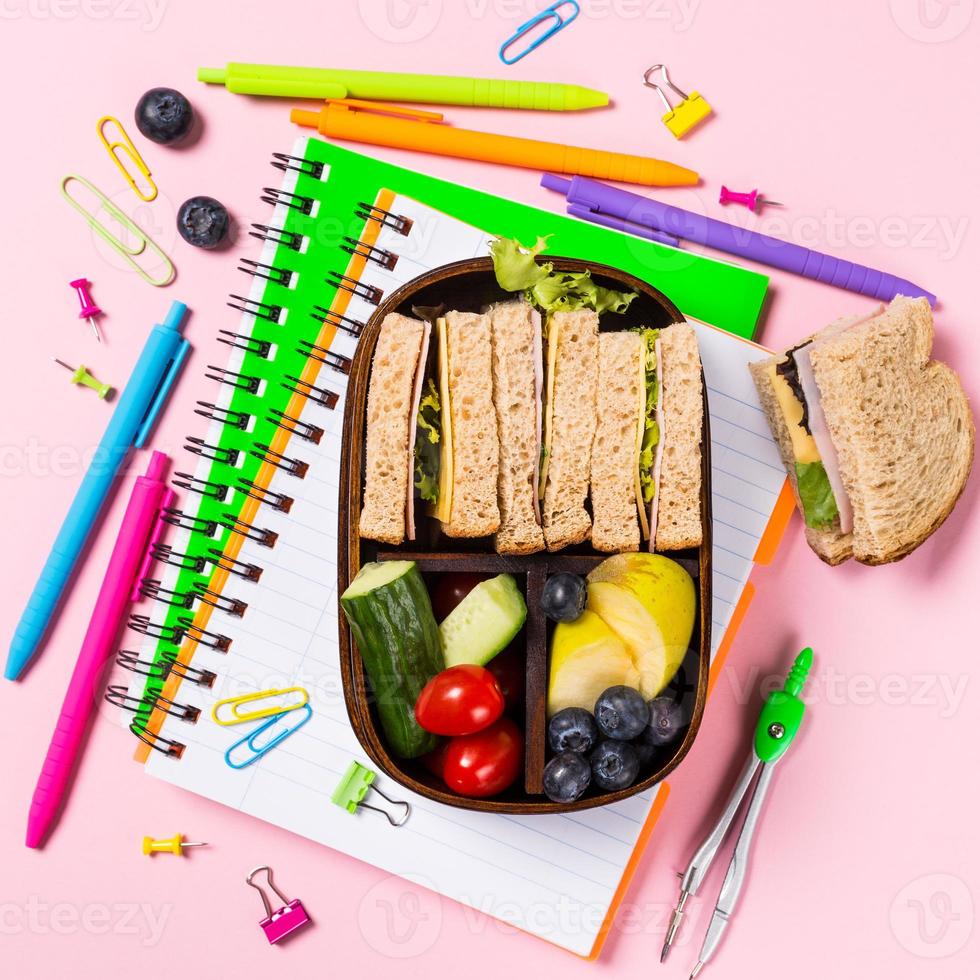 School wooden lunch box with sandwiches photo