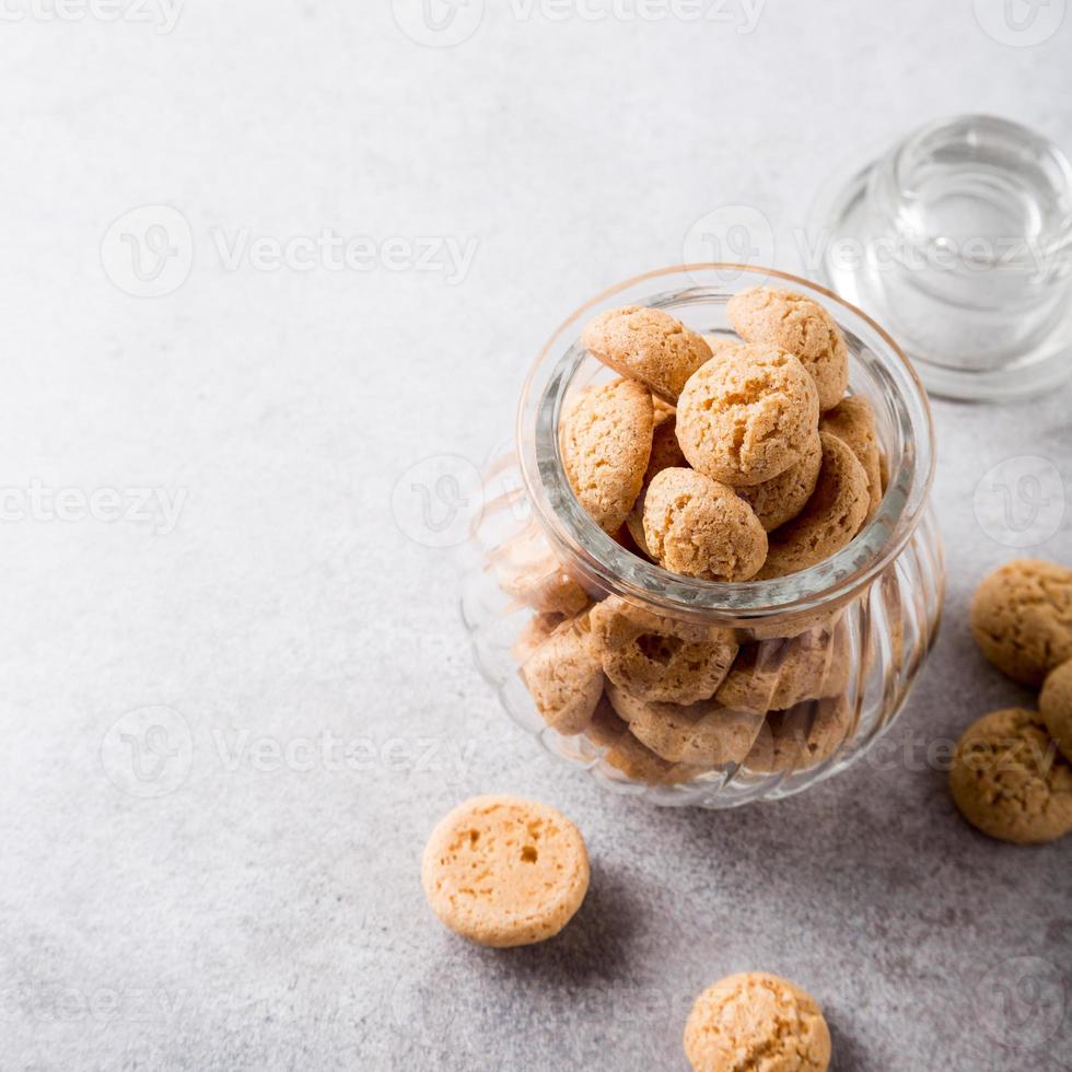 Amaretti cookies in glass pot photo