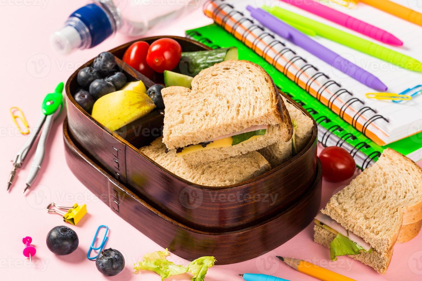 School wooden lunch box with sandwiches photo