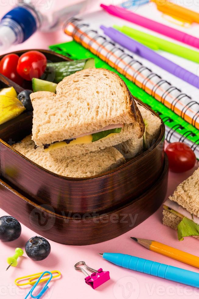 School wooden lunch box with sandwiches photo