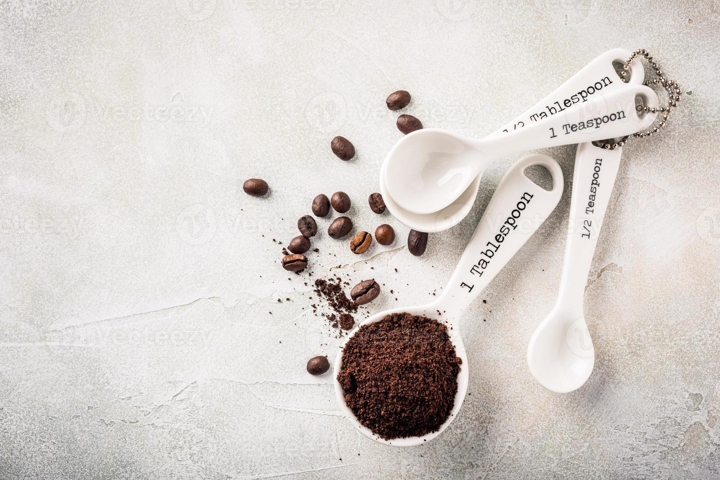 Measuring spoons with ground coffee photo