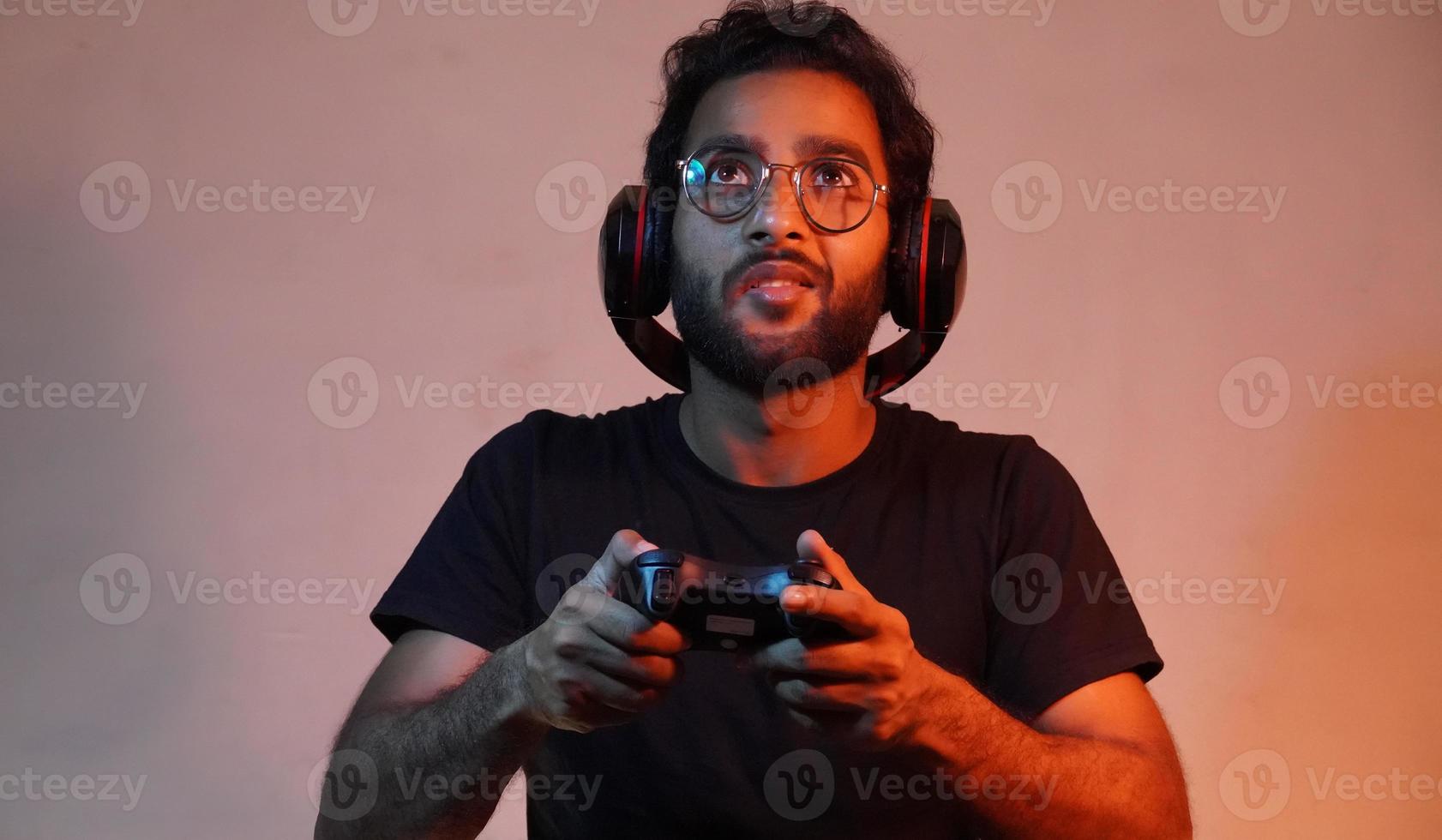 man playing game using gaming wireless joystick photo
