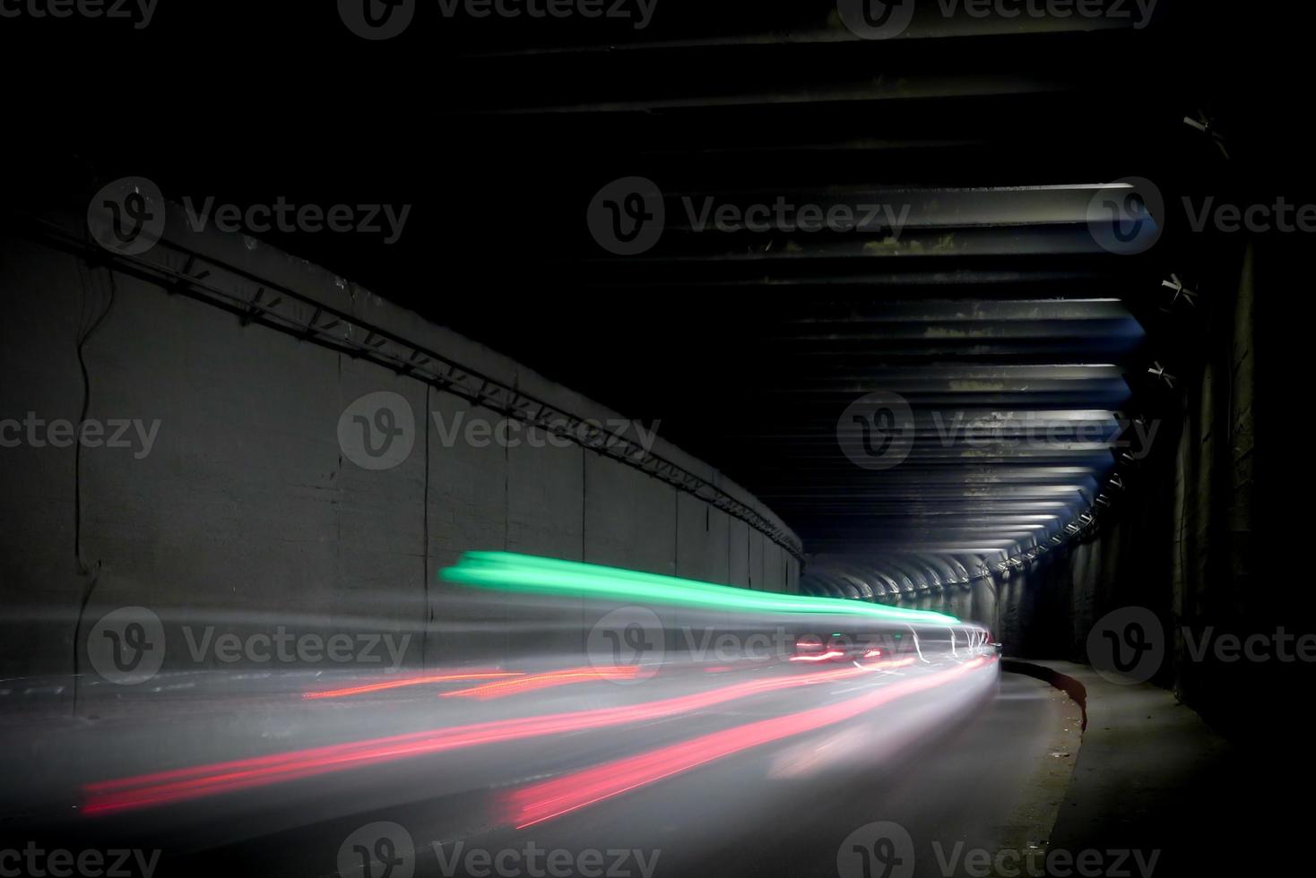 Dark tunnel with light trails. Motion blur image of a dark tunnel. photo