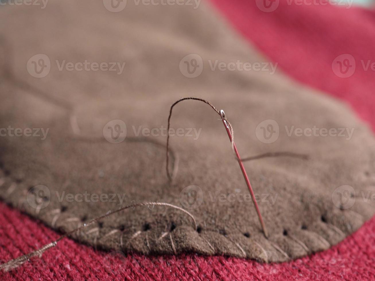 patch sewing with selective focus on needle photo