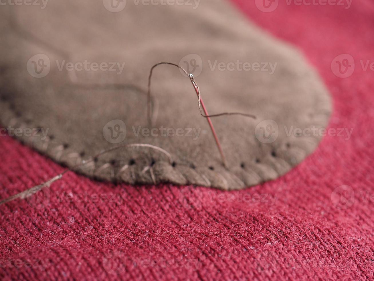 patch sewing with selective focus on needle photo