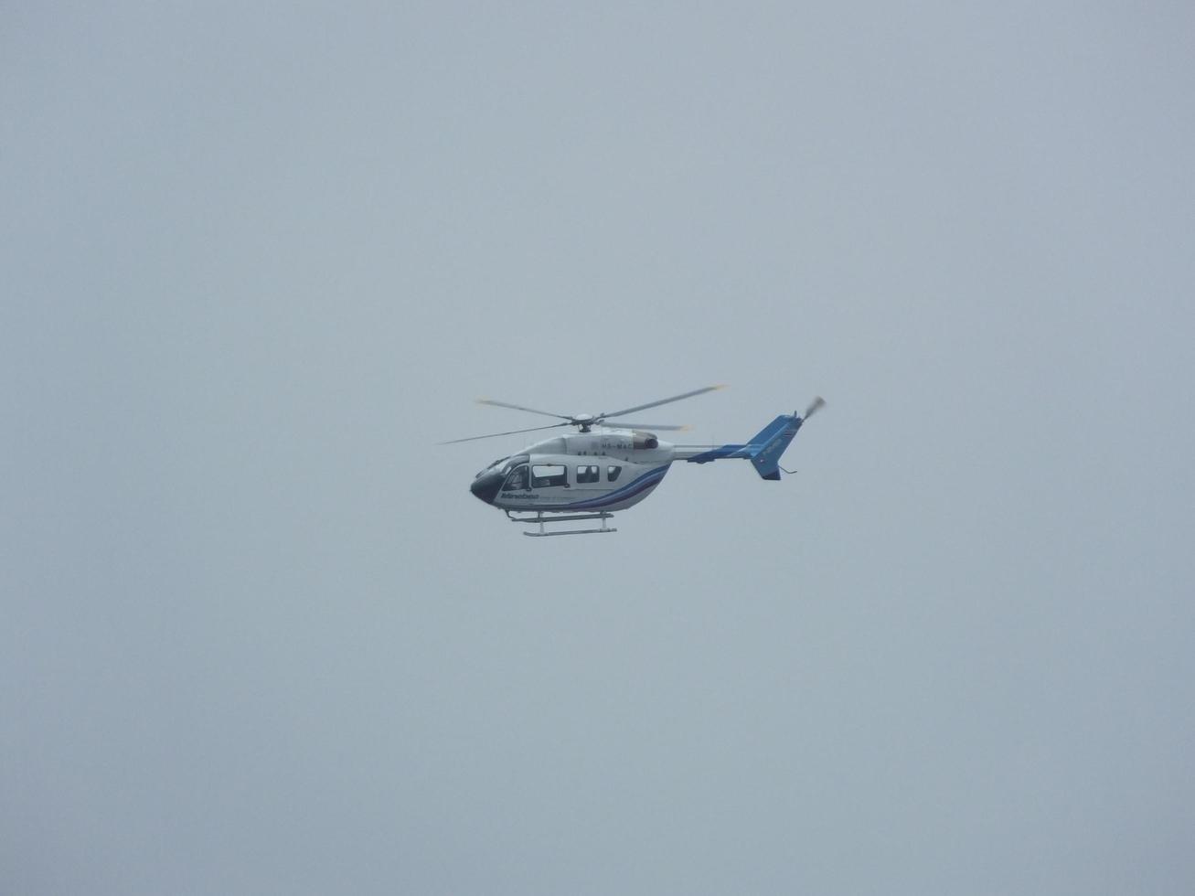 BANGKOK THAILAND13 MAY 2019Helicopters that fly upwards sending VIPs to the top of a tall building in Bangkok.on BANGKOK THAILAND13 MAY 2019 photo