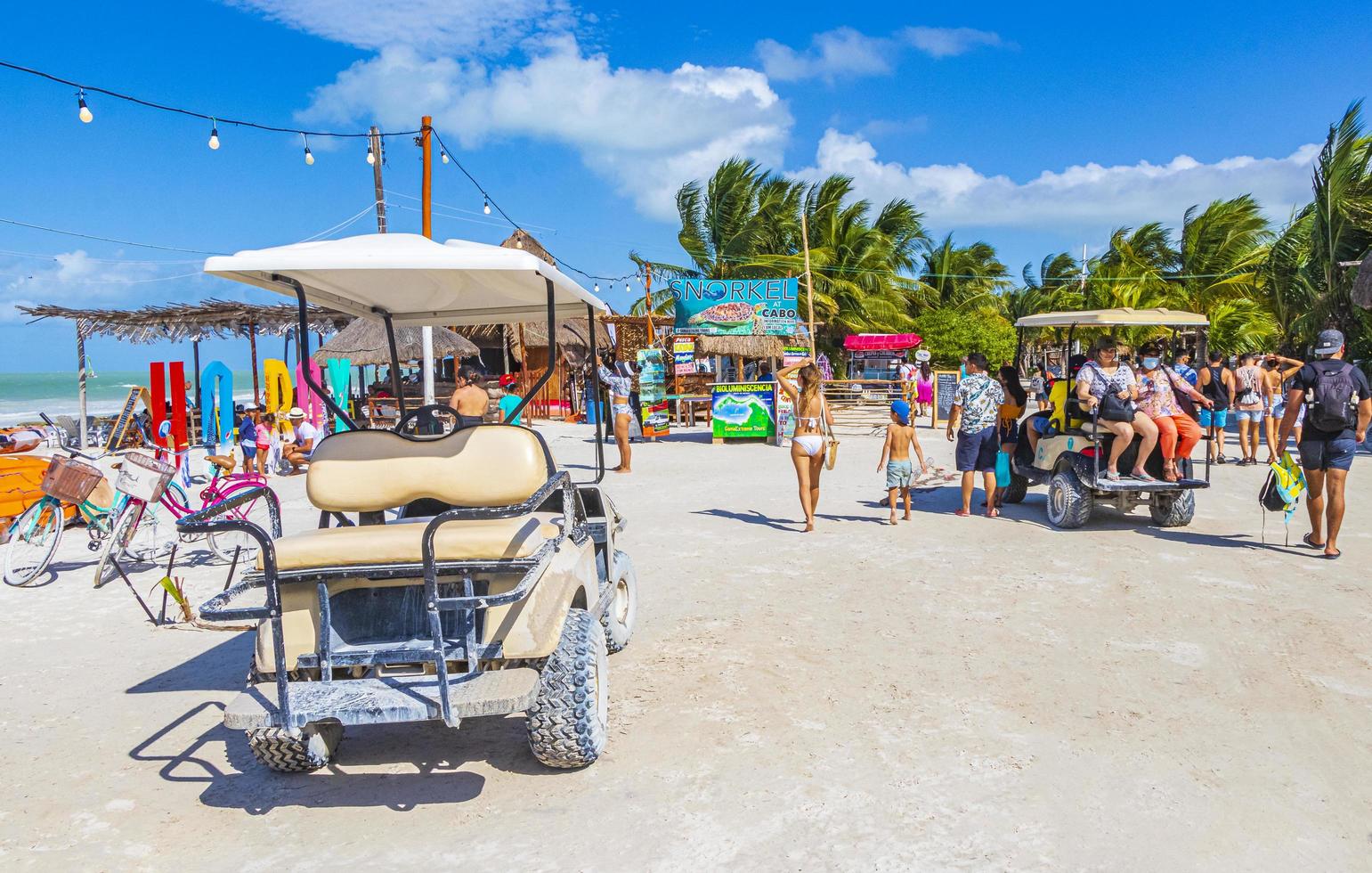 Holbox Mexico 21. December 2021 Golf cart cars carts sandy muddy street beach Holbox Mexico. photo