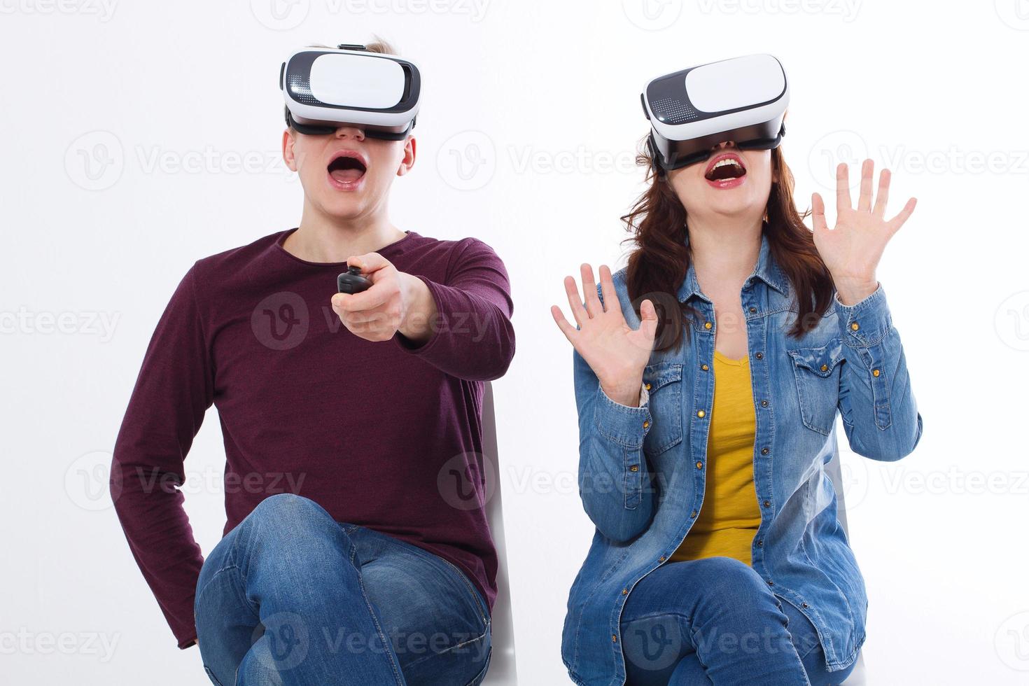 Young man and woman in casual clothes in virtual goggles, vr isolated on white background. Technology and innovation concept. Copy space and mock up. Template photo