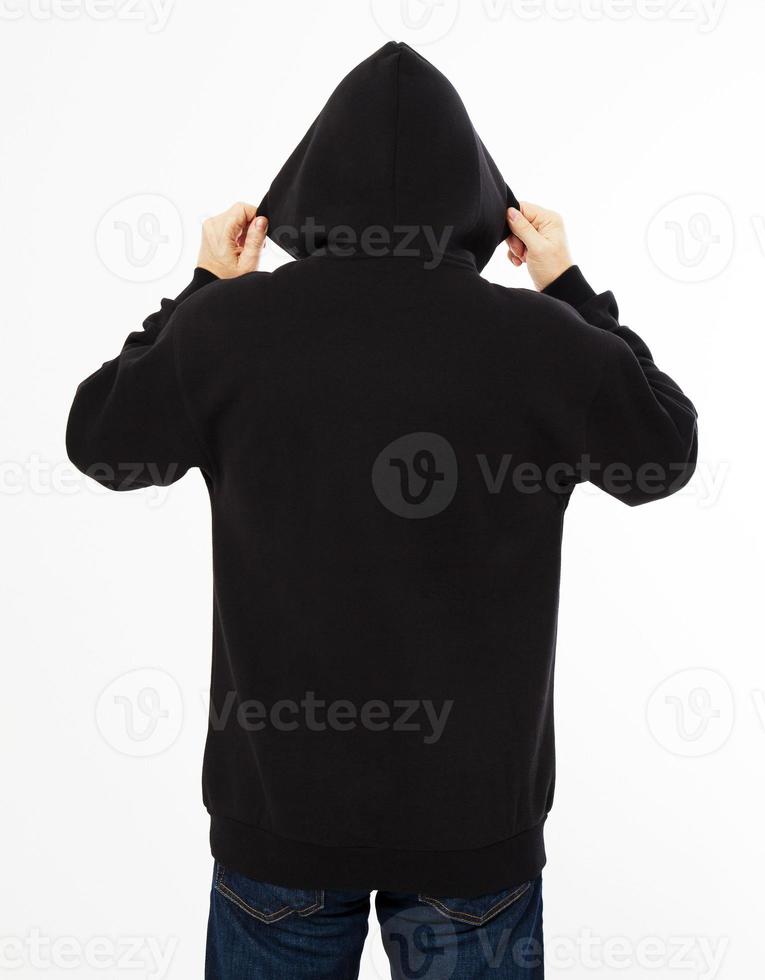 man in a black sweatshirt with a hood on his head is isolated on a white background - back view, top view photo