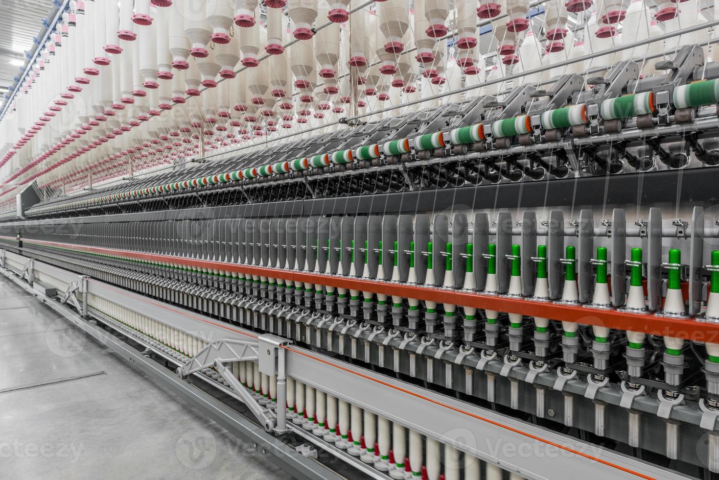 Machinery and equipment in the workshop for the production of thread. Industrial textile factory photo