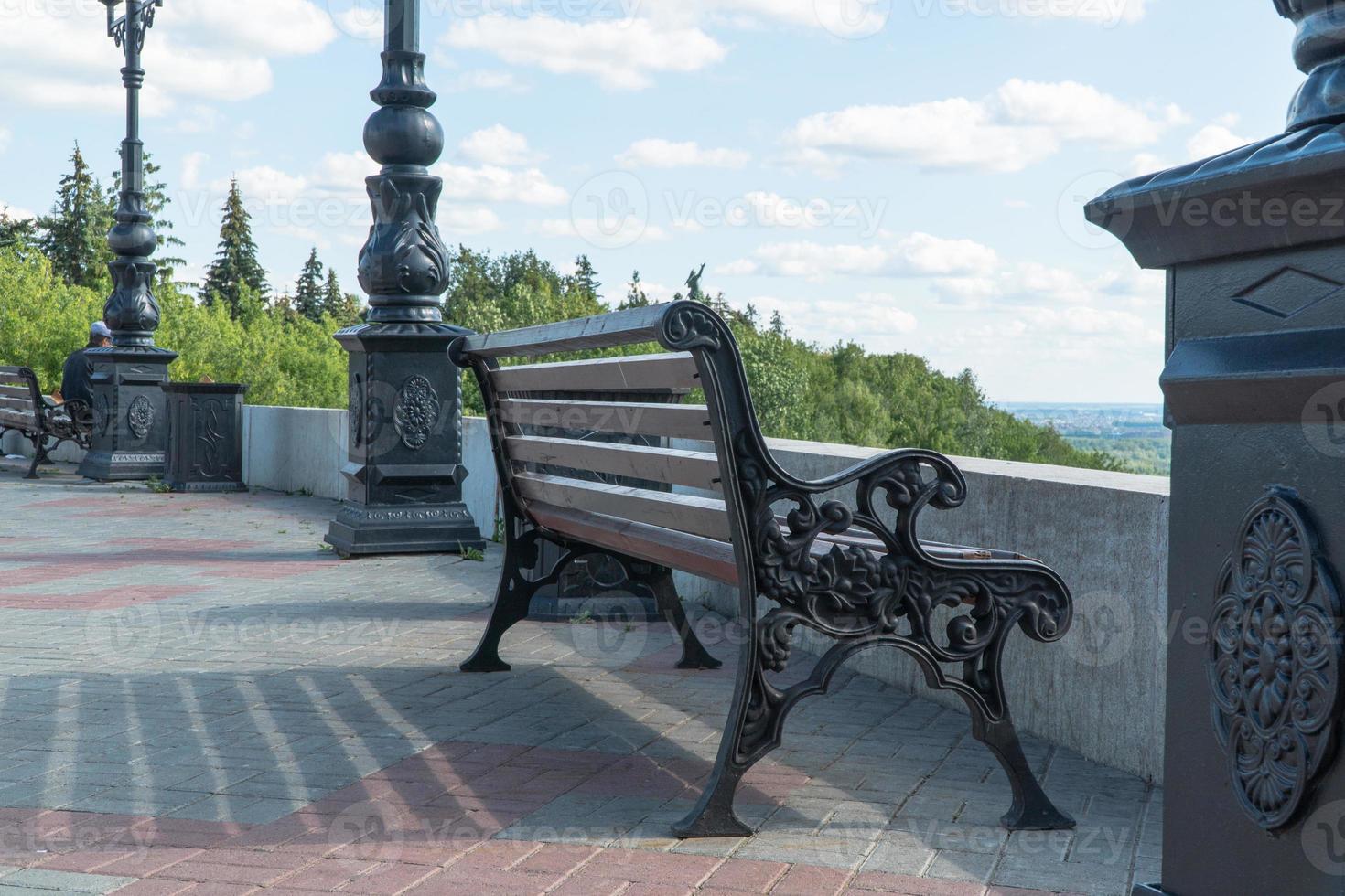 bench on the observation deck against the sky photo