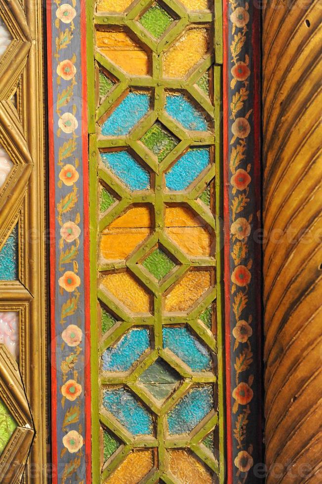 ancient Asian mosaic made of wood. elements of Oriental ornament photo
