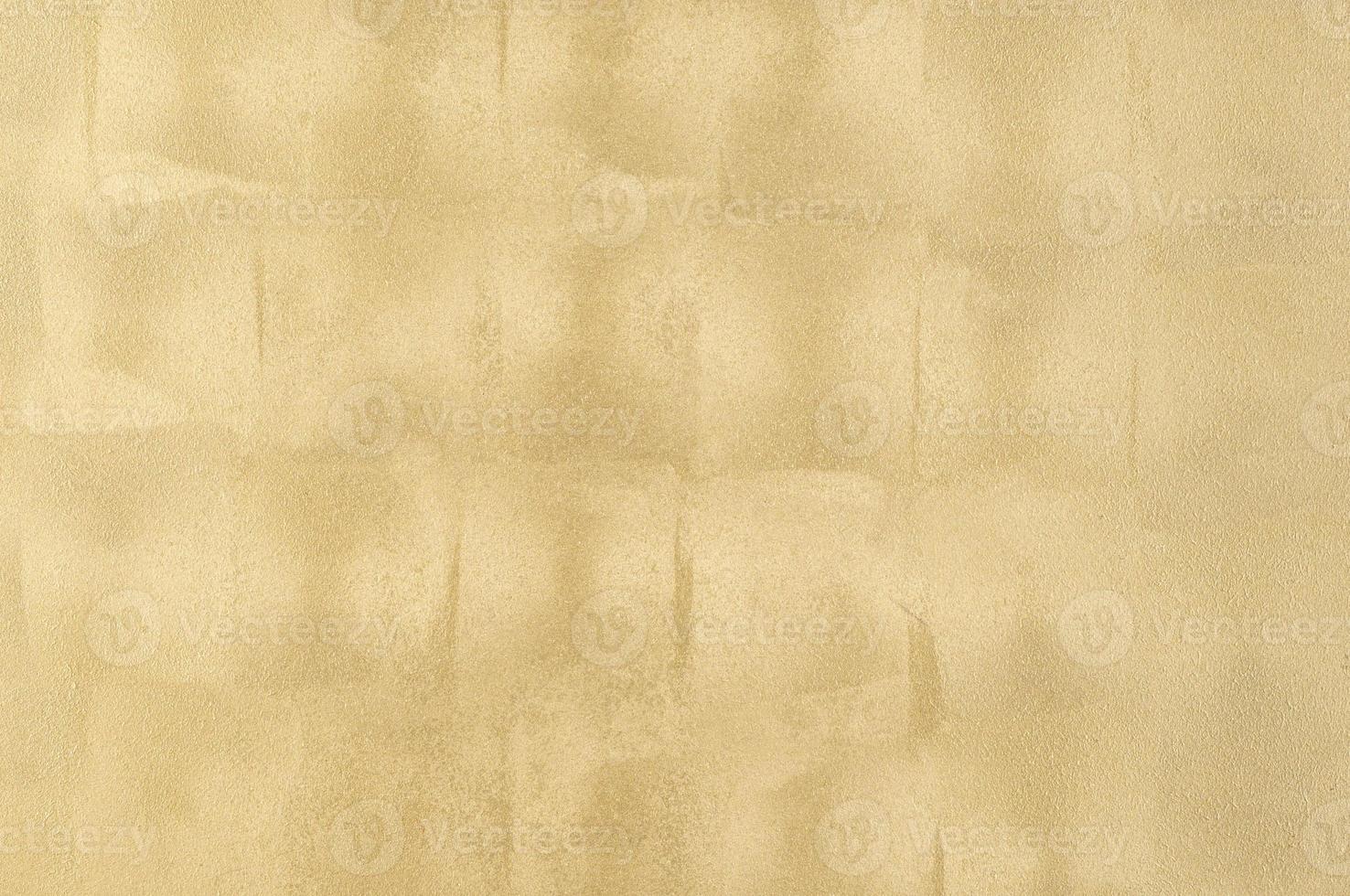 background of the plastered texture with marble effect gold color. artistic background handmade photo