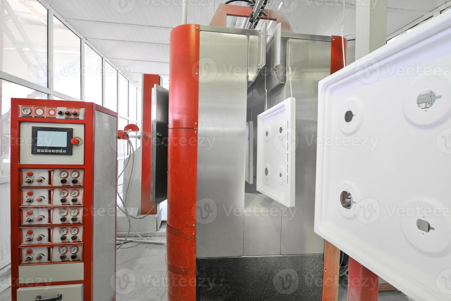 factory floor on painting of oven on a conveyor belt photo