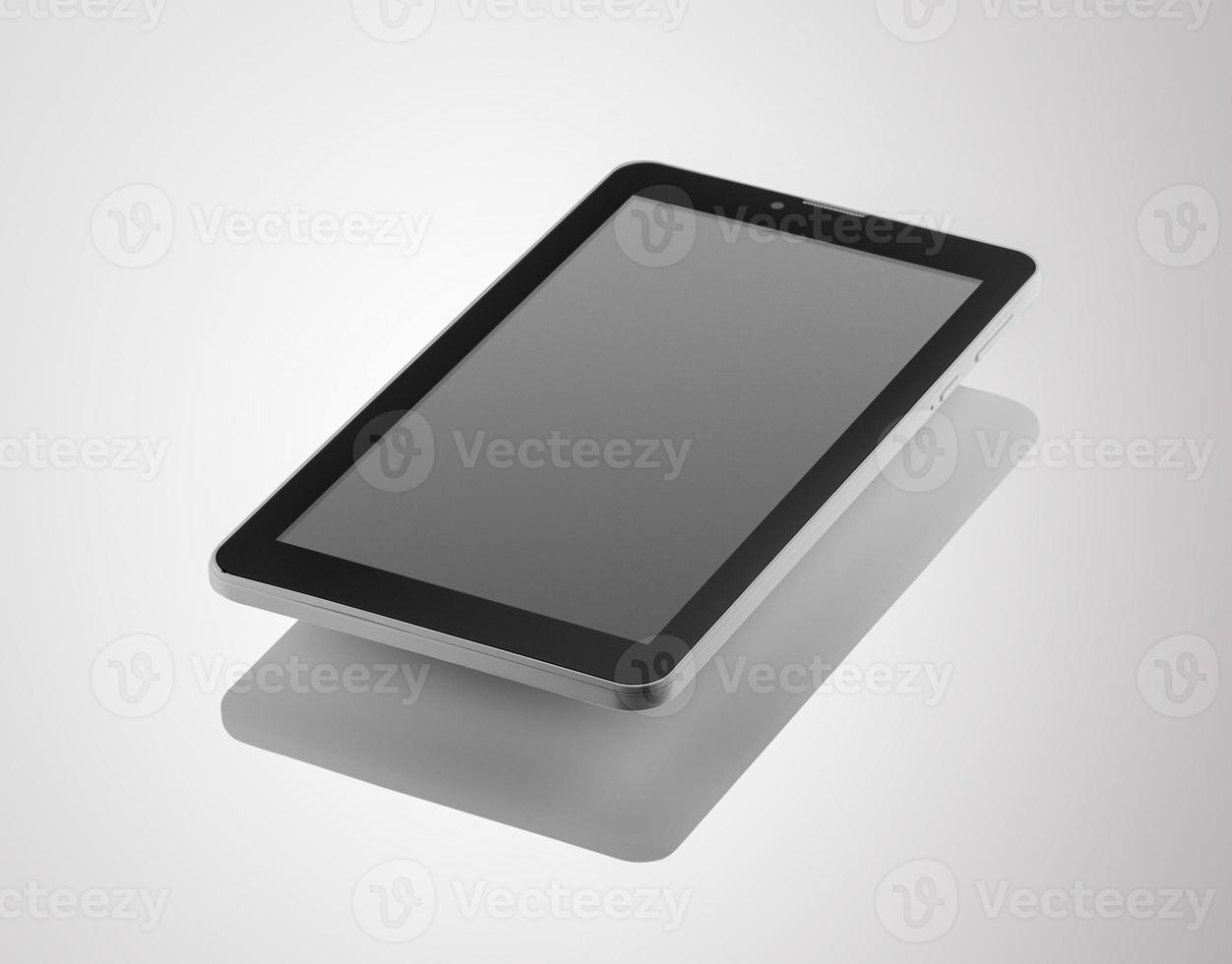 Black a tablet with reflection on a dark background closeup photo