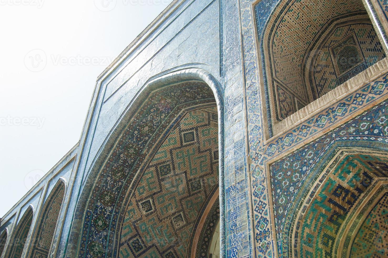 Arch and architecture of the ancient Registan in Samarkand. Ancient architecture of Central Asia photo