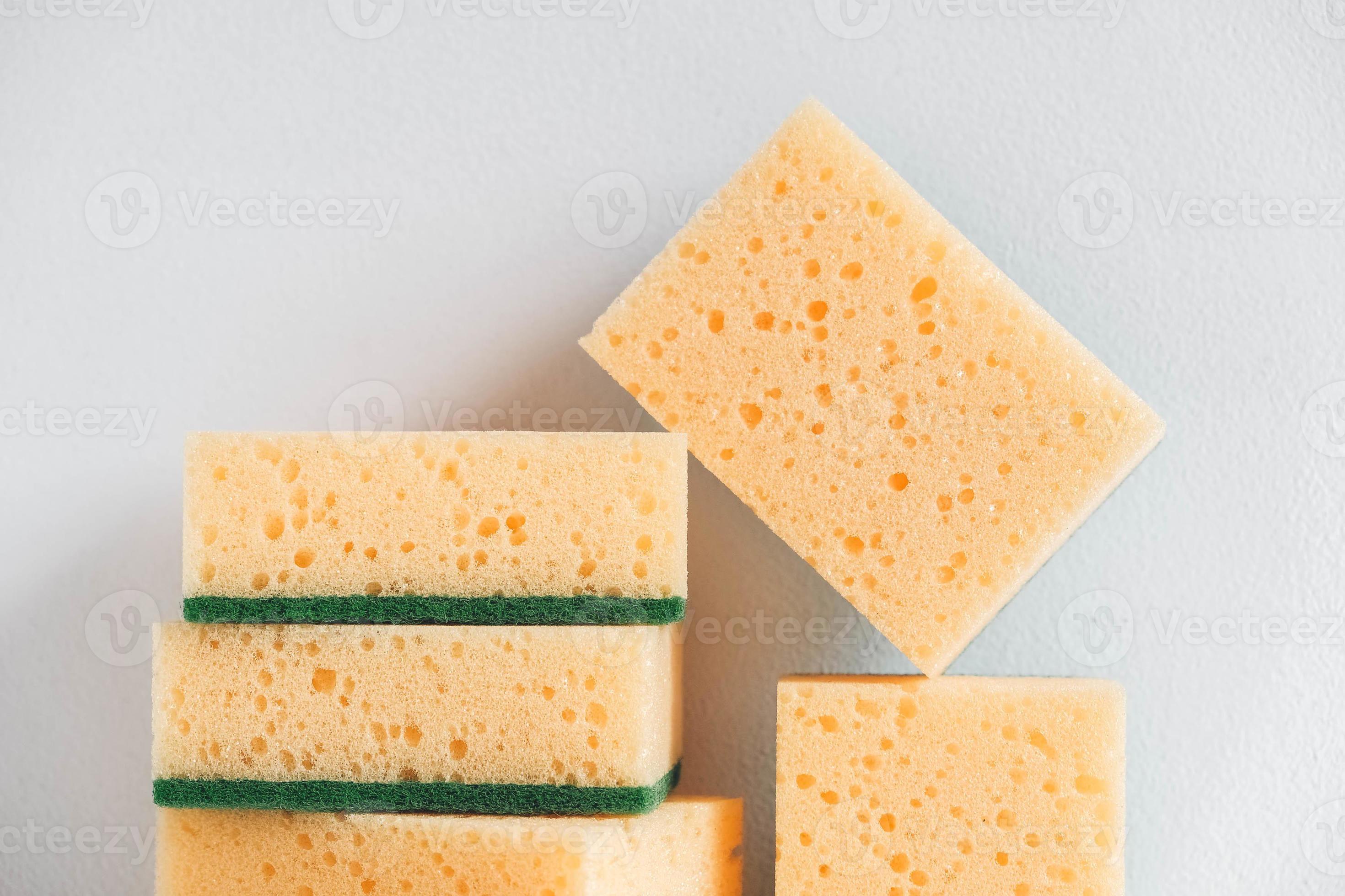 Yellow sponges on a white background 5342702 Stock Photo at Vecteezy