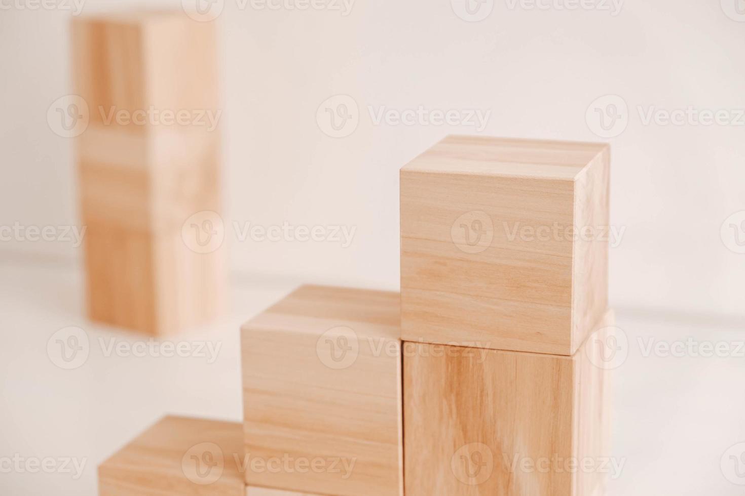 Stack wooden blocks from natural wood on a white background. Copy, empty space for text photo