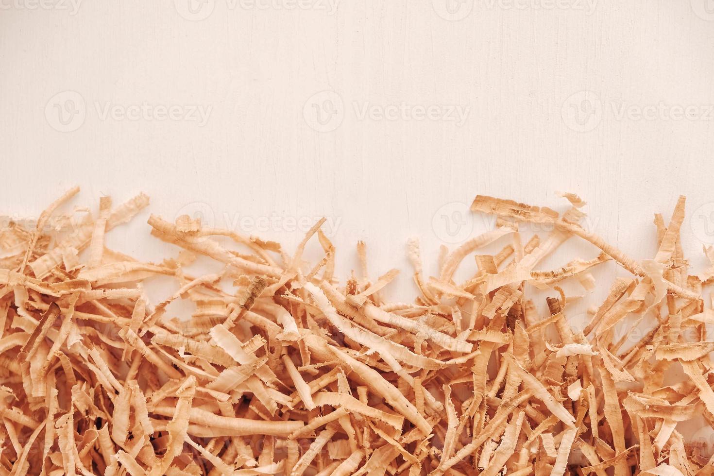 Wood shavings on white background. Top view. Copy, empty space for text photo