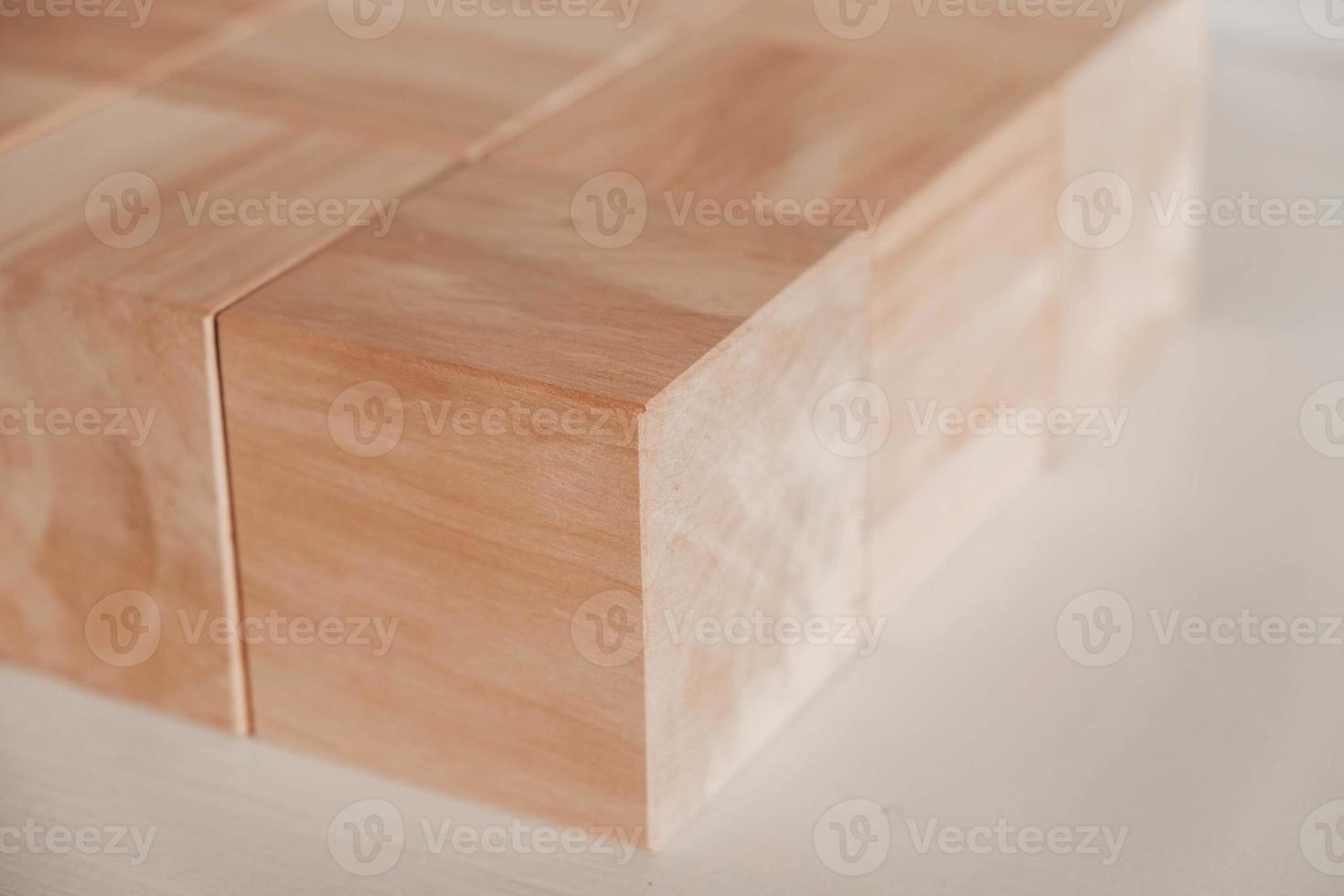 Wooden cubes from natural wood on a white background. Copy, empty space for text photo