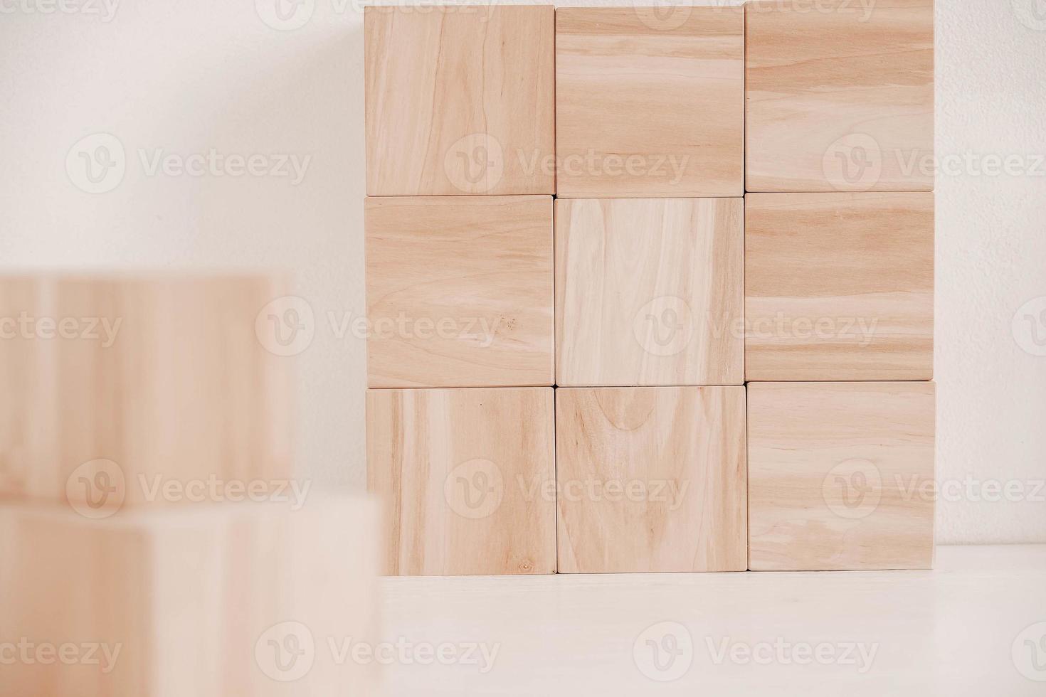 Wooden cubes from natural wood on a white background. Copy, empty space for text photo