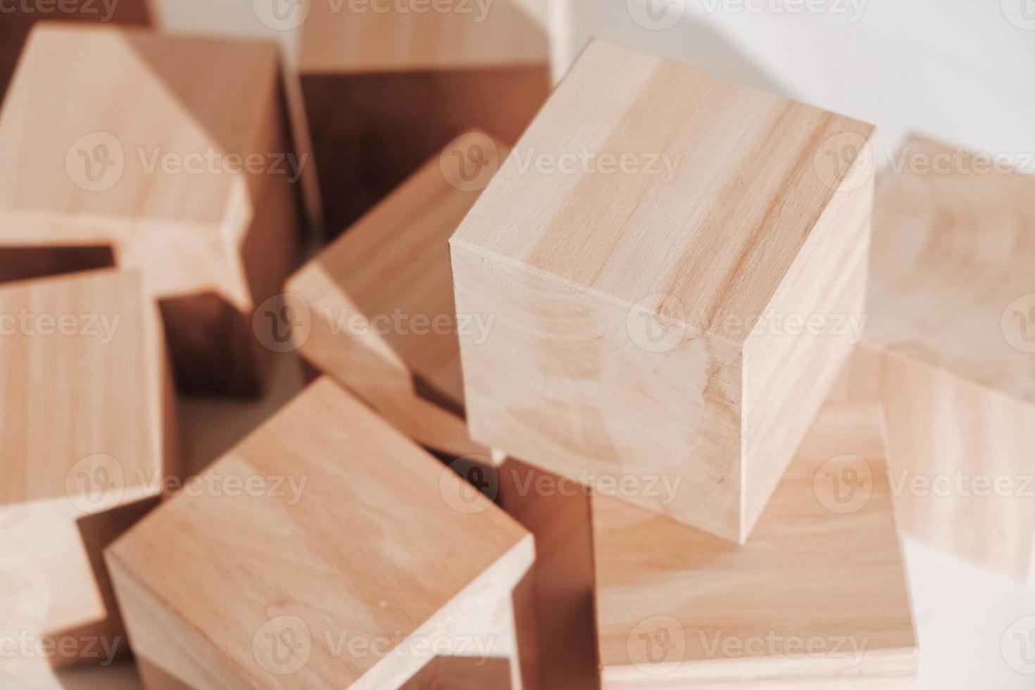 Wooden cubes from natural wood on a white background. Copy, empty space for text photo