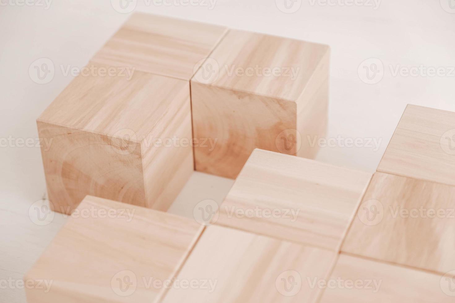Stack wooden blocks from natural wood on a white background. Copy, empty space for text photo