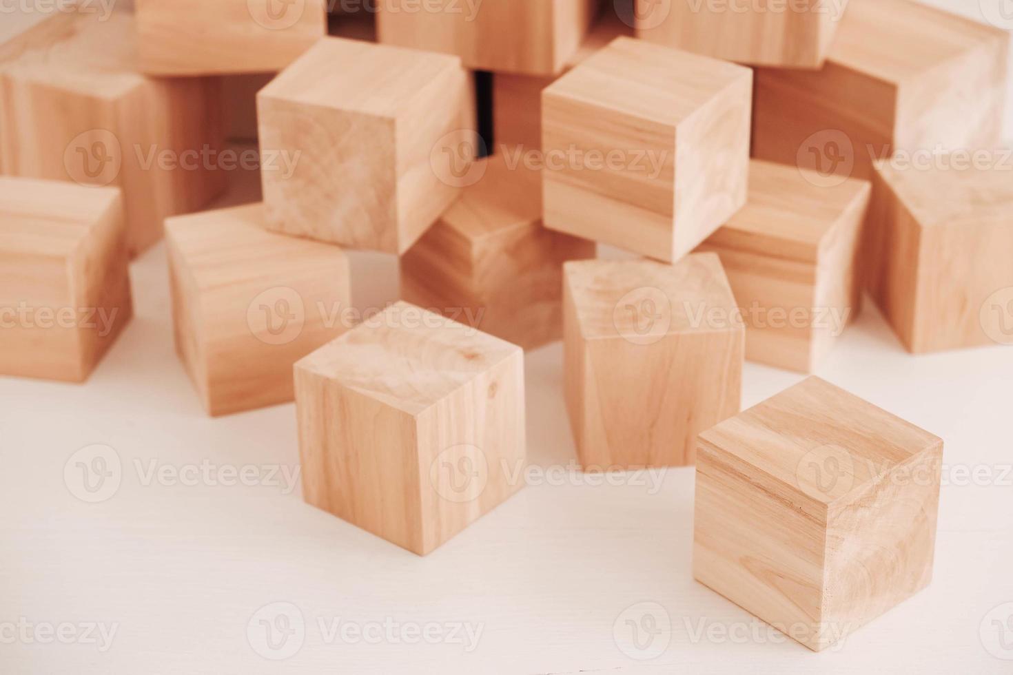 Stack wooden blocks from natural wood on a white background. Copy, empty space for text photo