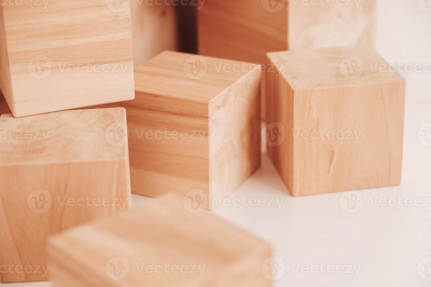 Stack wooden blocks from natural wood on a white background. Copy, empty space for text photo