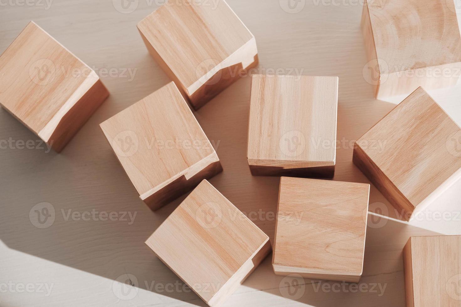 Wooden cubes from natural wood on a white background. Copy, empty space for text photo