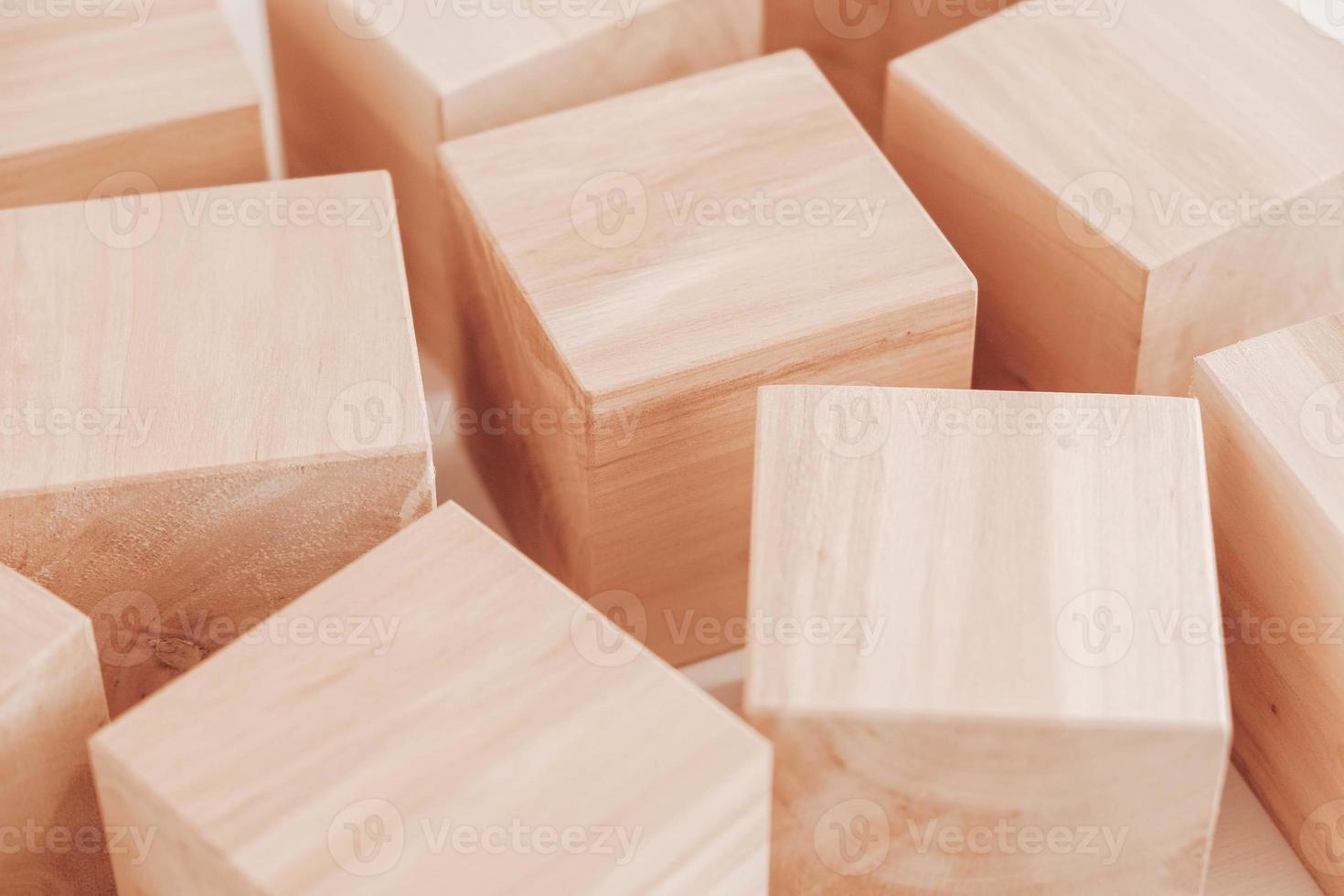 Wooden cubes from natural wood on a white background. Copy, empty space for text photo