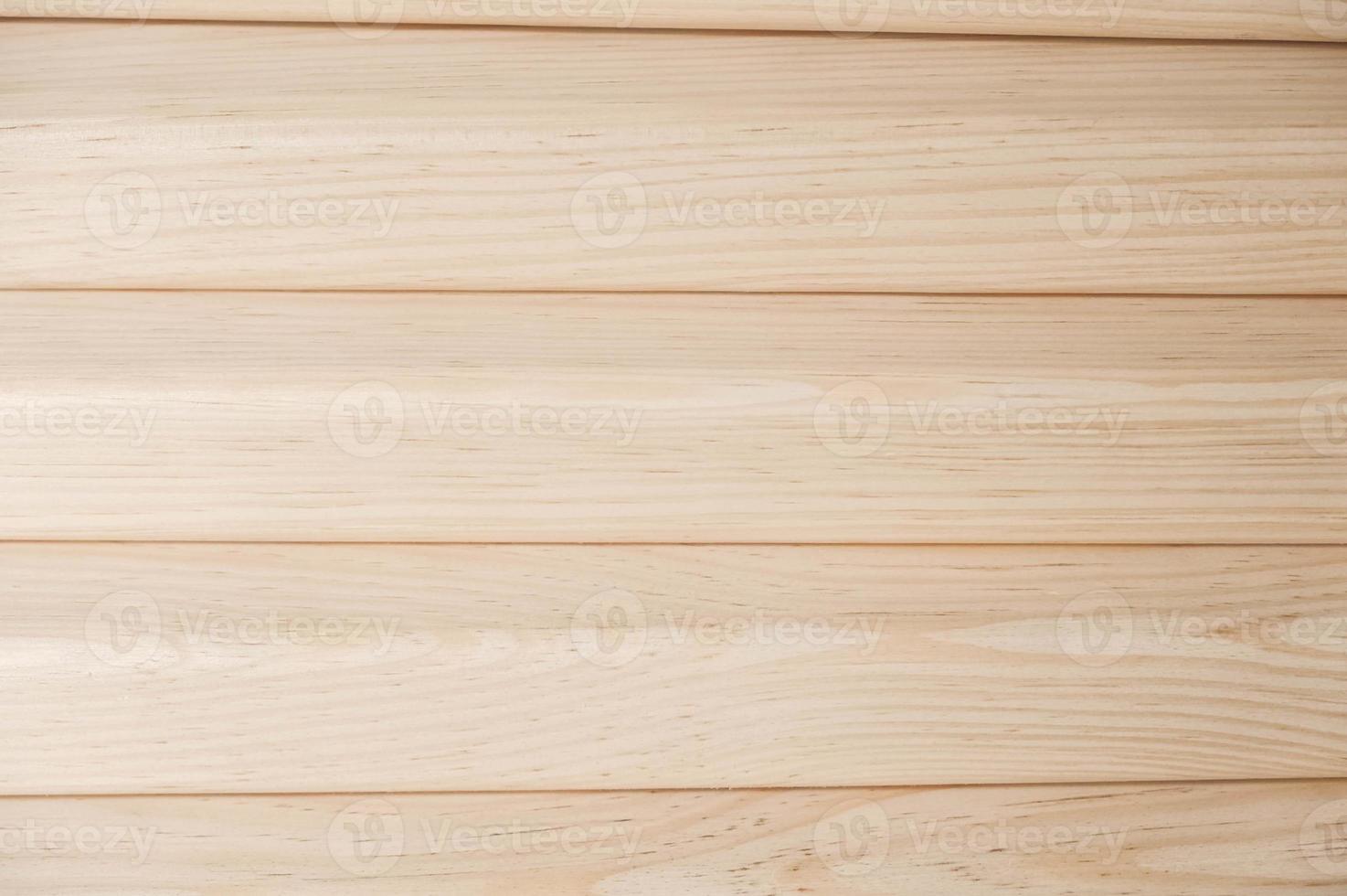 Joiner s boards from light natural wood are stacked on each other. Timber harvesting. Details of a lumber bar close-up. Hobbies of needlework, woodworking photo