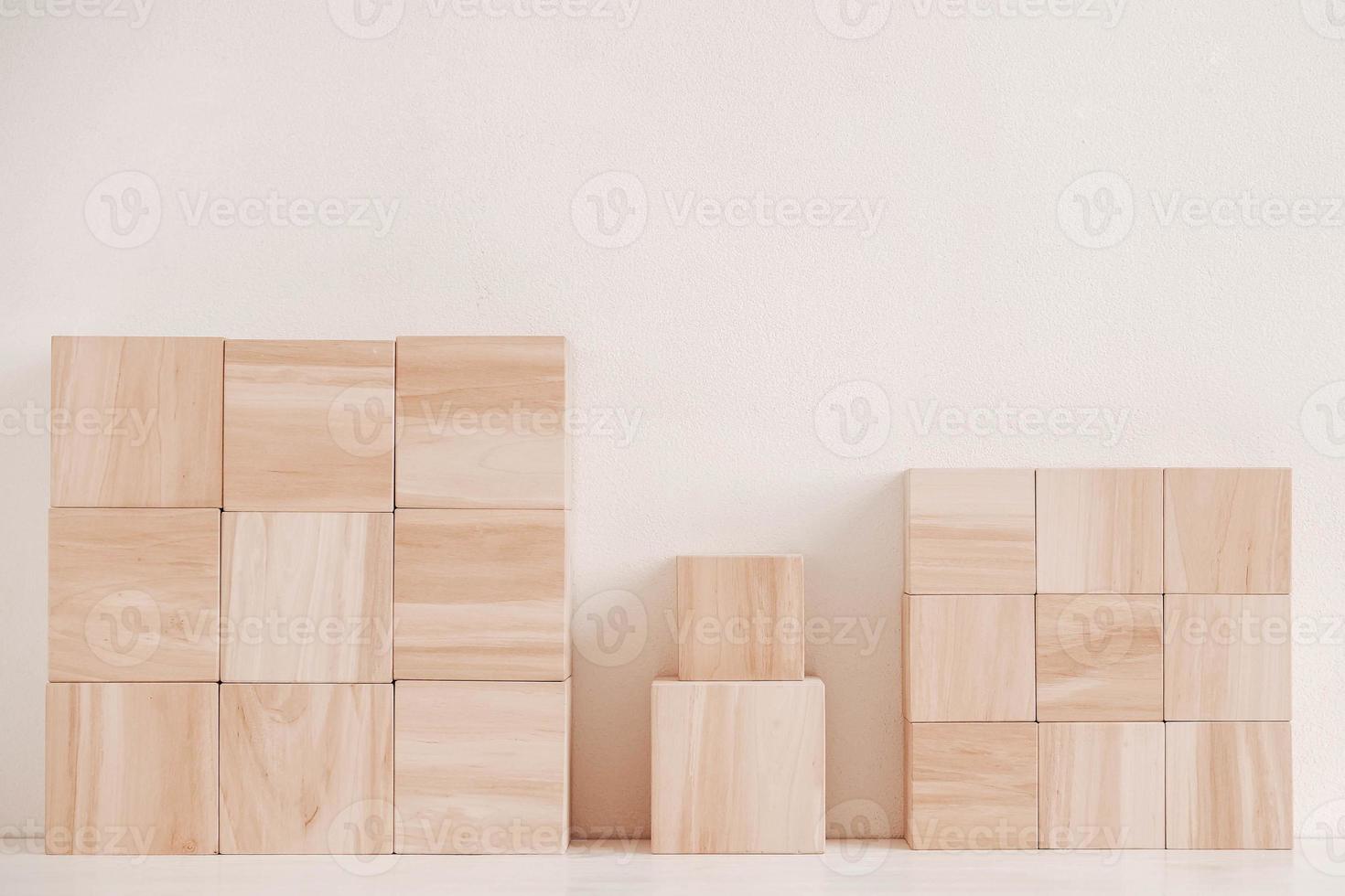 Wooden cubes from natural wood on a white background. Copy, empty space for text photo