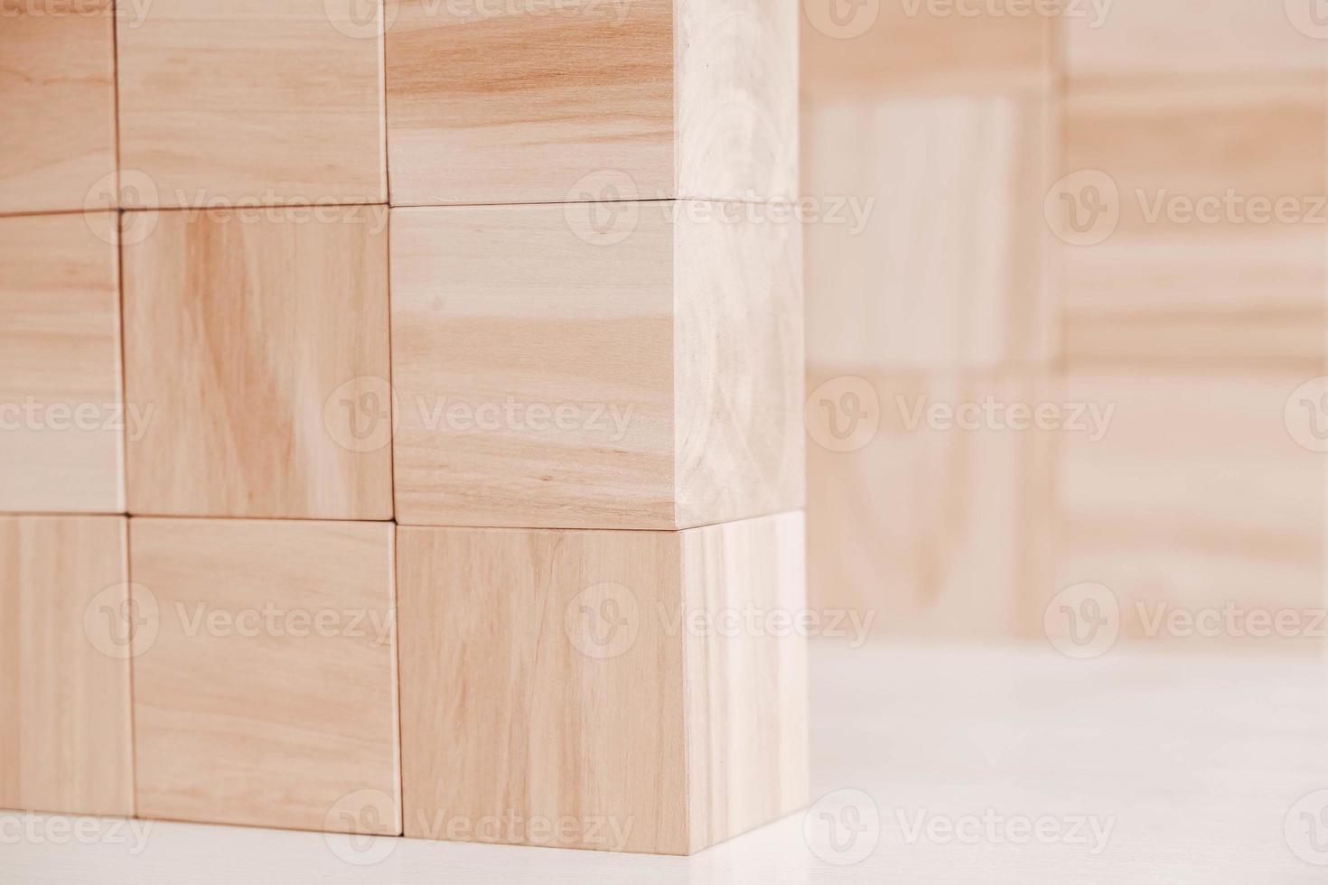 Wooden cubes from natural wood on a white background. Copy, empty space for text photo