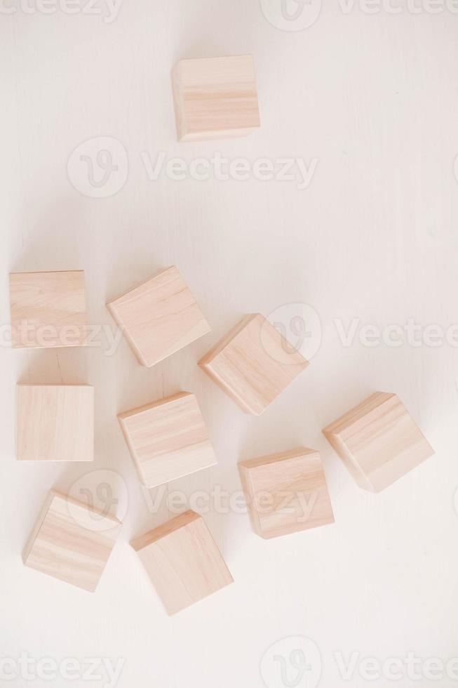 Stack wooden blocks from natural wood on a white background. Top view. Copy, empty space for text photo