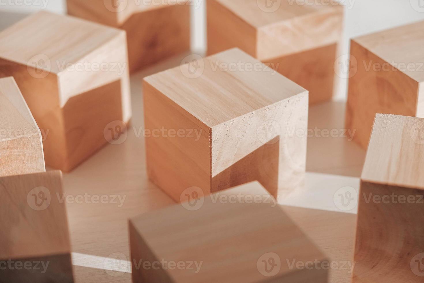 Wooden cubes from natural wood on a white background. Copy, empty space for text photo