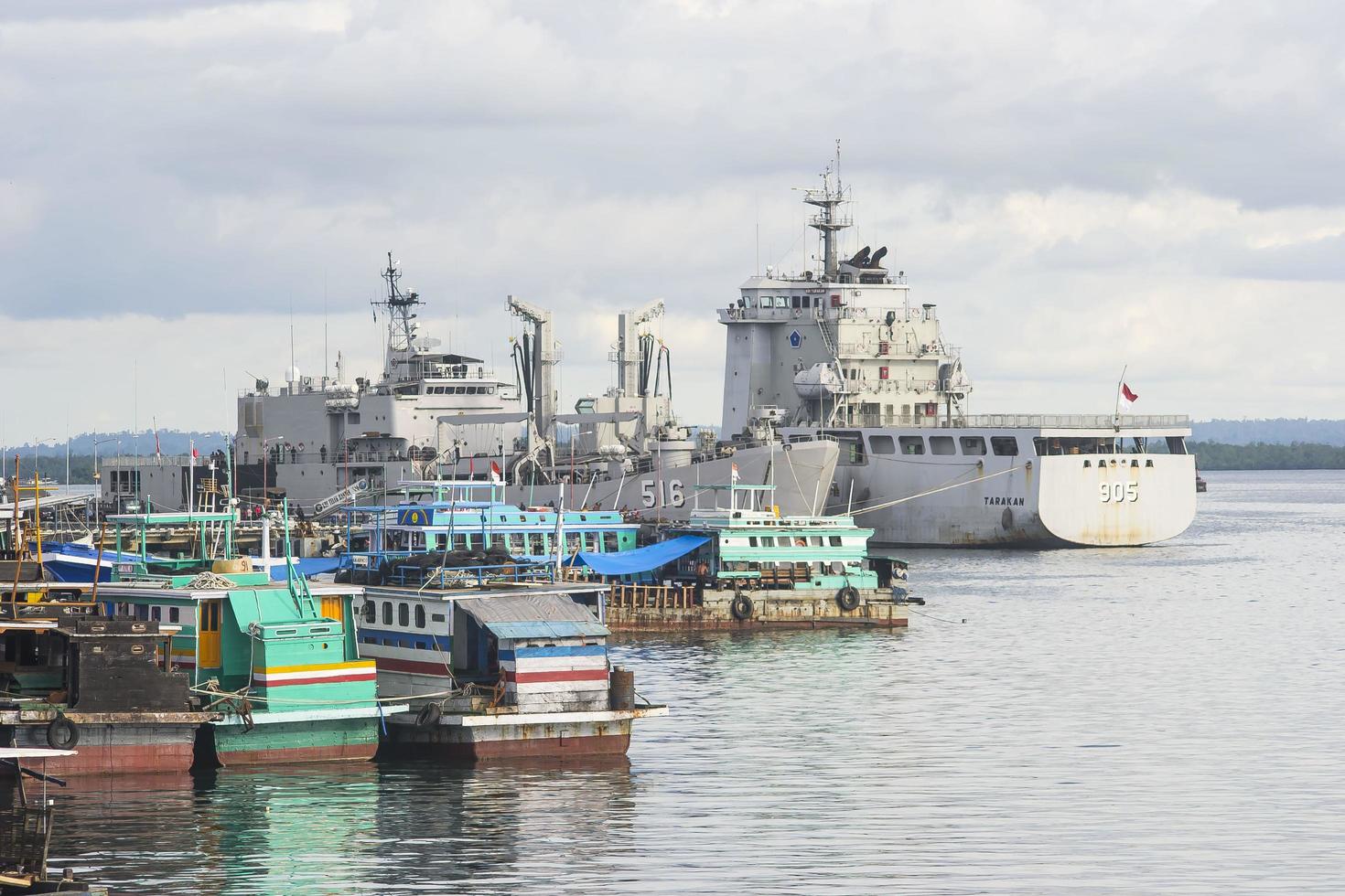 Military ship mooring at the naval dock photo