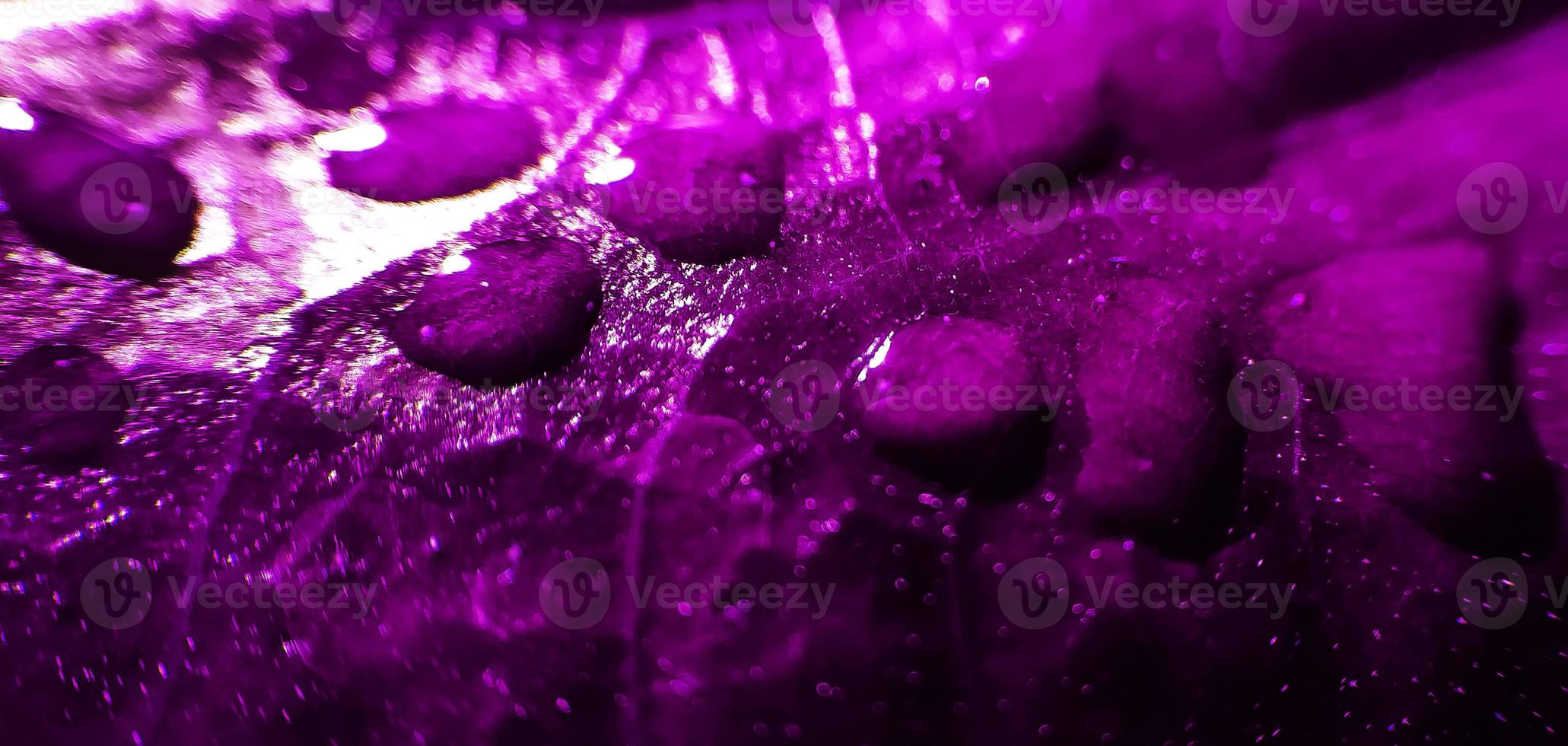 Natural background close up image. Beautiful drops of transparent rain water on a colored leaf macro. photo