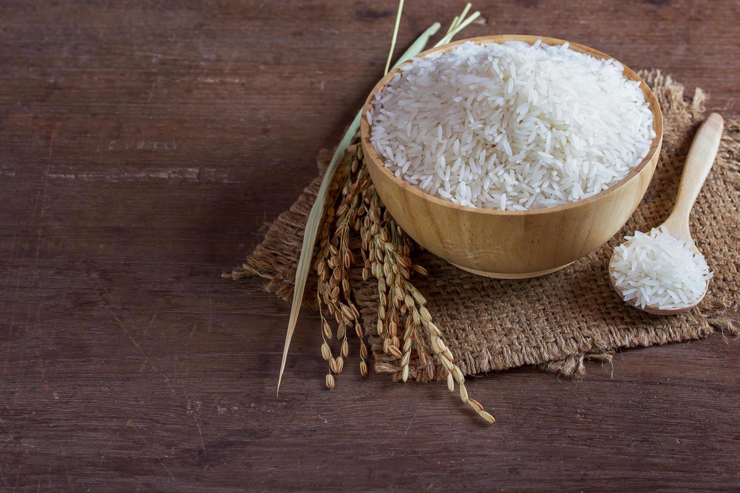 Jasmine rice in wooden bowl photo