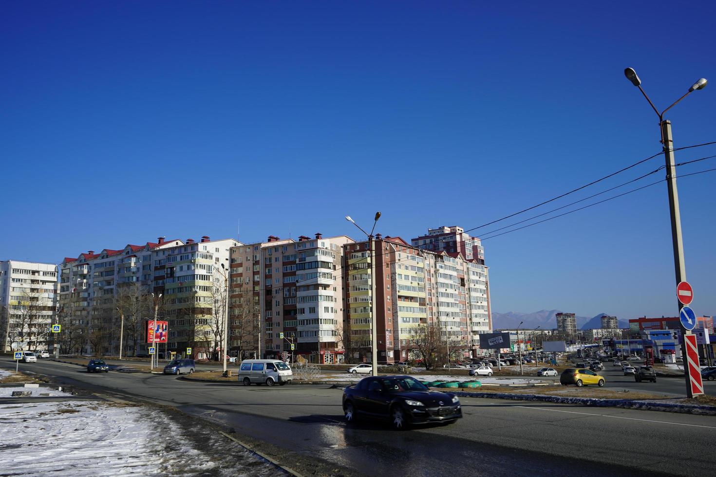 Nakhodka, Russia-January 10, 2020 -Urban landscape with views of the road, buildings and people. photo