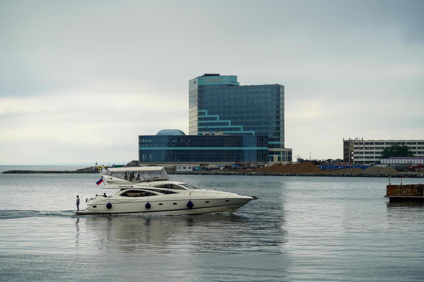 Vladivostok, Russia-July 6, 2020 - White boat on the background of the seascape with people. photo