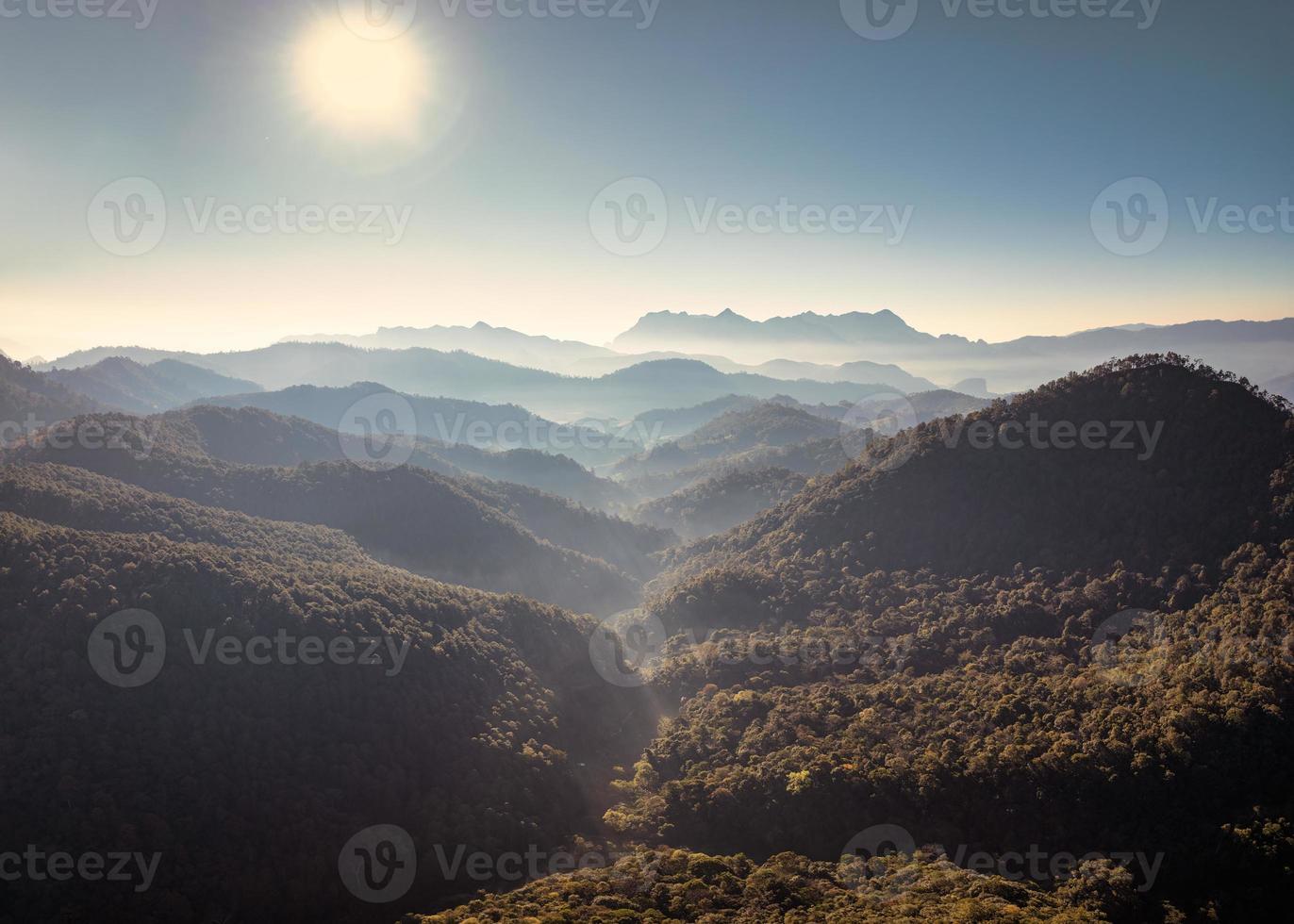 Scenery of Doi Luang Chiang Dao with mountain layer and fog on sunny day in tropical rainforest at national park photo